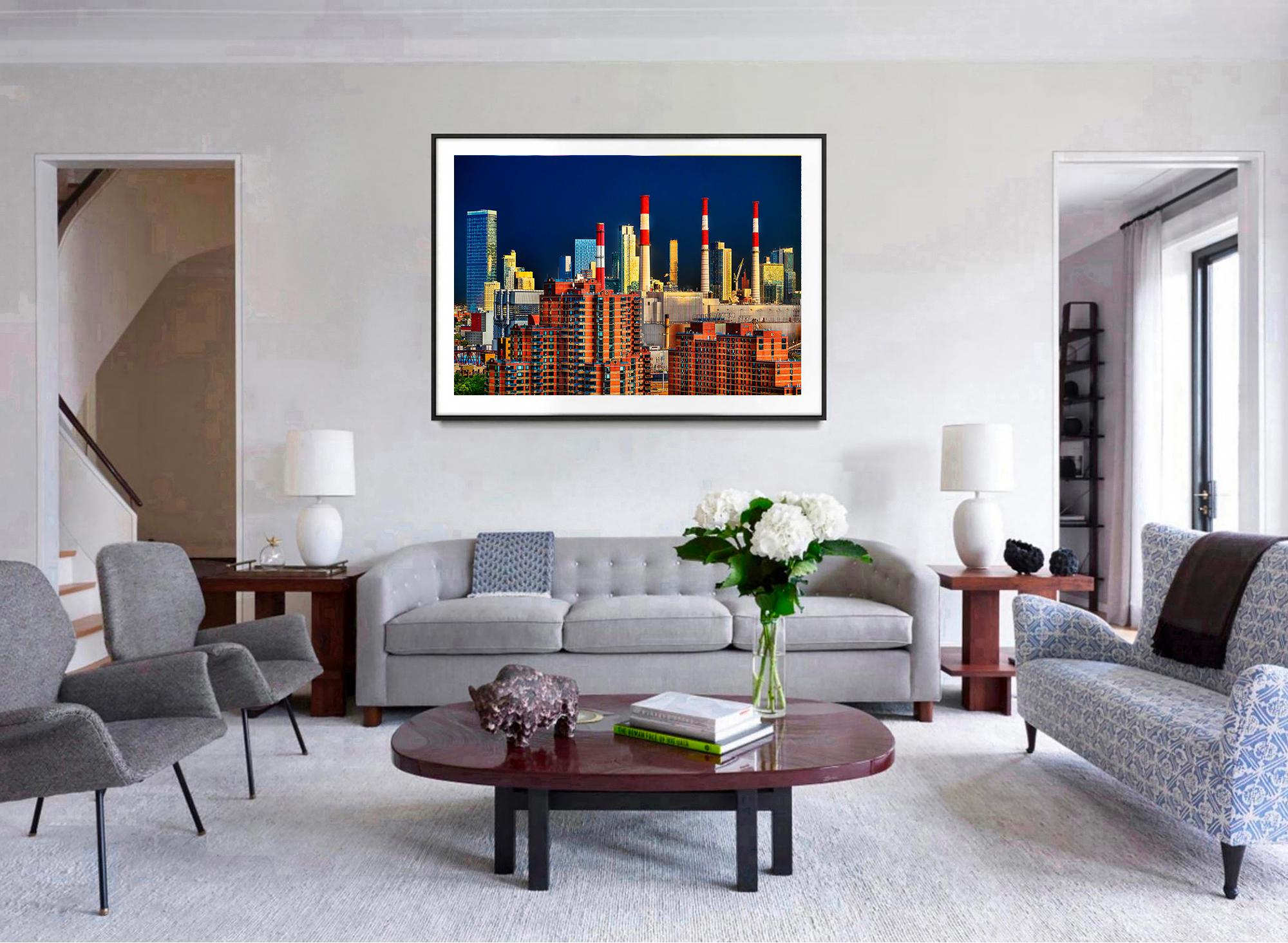 Perched high on the roof of an East Side highrise, Mitchell Funk merges the boroughs.  Funk creates a new New York City Skyline composed of buildings and smokestacks by selecting the right angle and waiting for a magically mystical light.  This is a