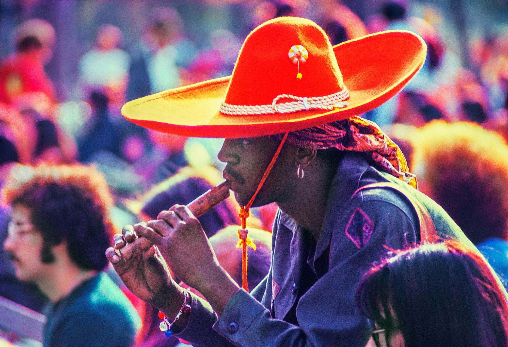 Mitchell Funk Color Photograph - Black Hippie Red Sombrero  n' Flute Central Park Music Festival 60's Celebration