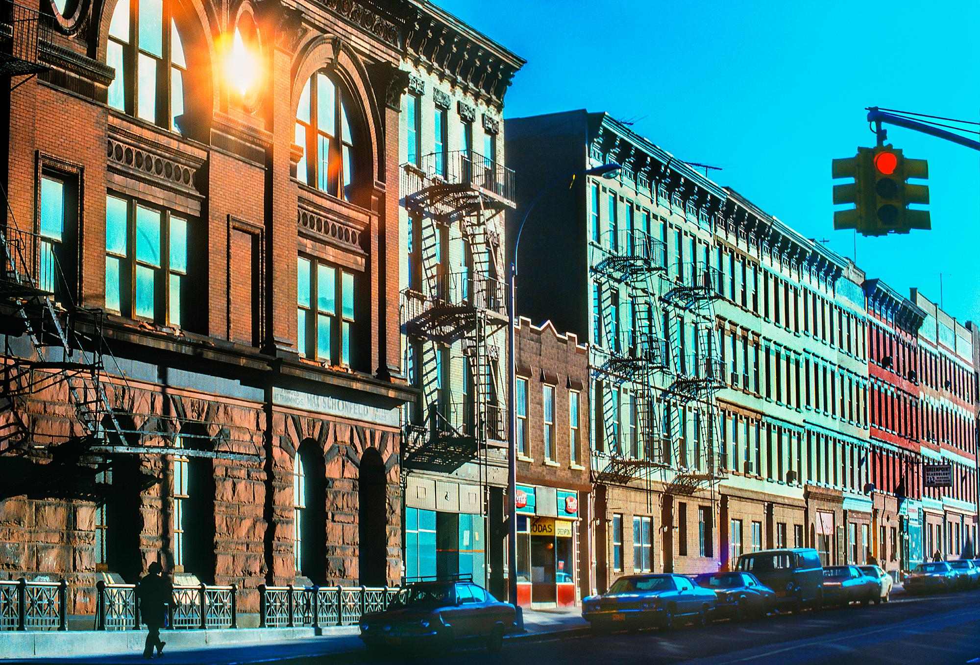 Mitchell Funk Color Photograph - Brooklyn Row Houses with Candy Store and 19th-century buildings