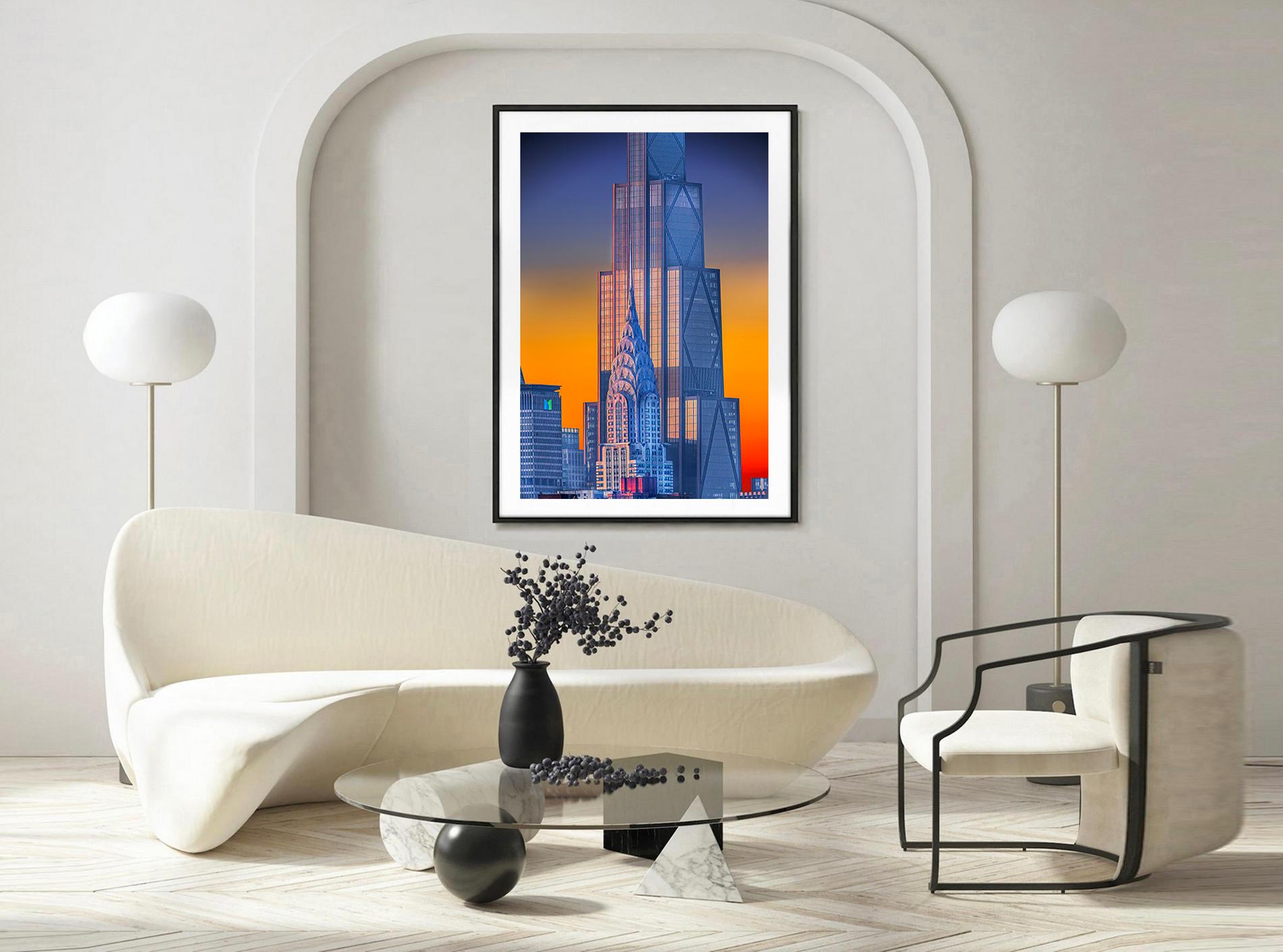 Con la suave luz pastel de primera hora de la mañana, el fotógrafo Mitchell Funk capta el emblemático edificio Art Decó Chrysler frente al edificio de la sede central del banco Chase. Además de ser una imagen visualmente bella del centro de