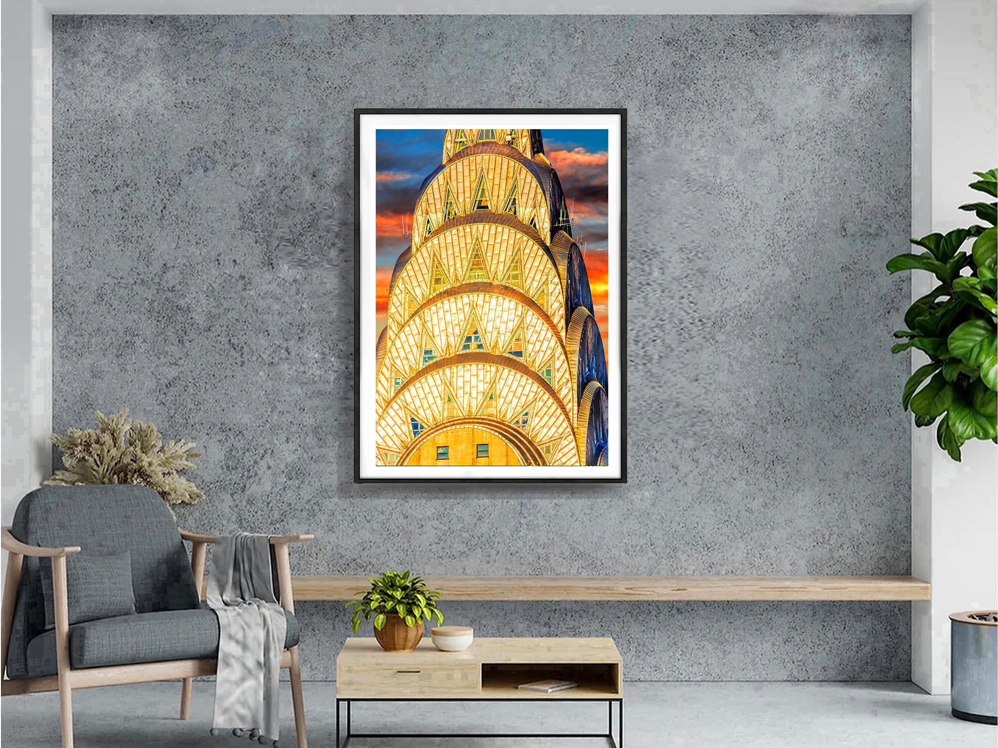 The metallic crown of the Chrysler Building reflects the golden light of sunset, giving it a jewel-like appearance. It's as if an elegant woman could wear it on her wrist.  Horizontal bands of clouds complement the curvilinear forms of the crown,