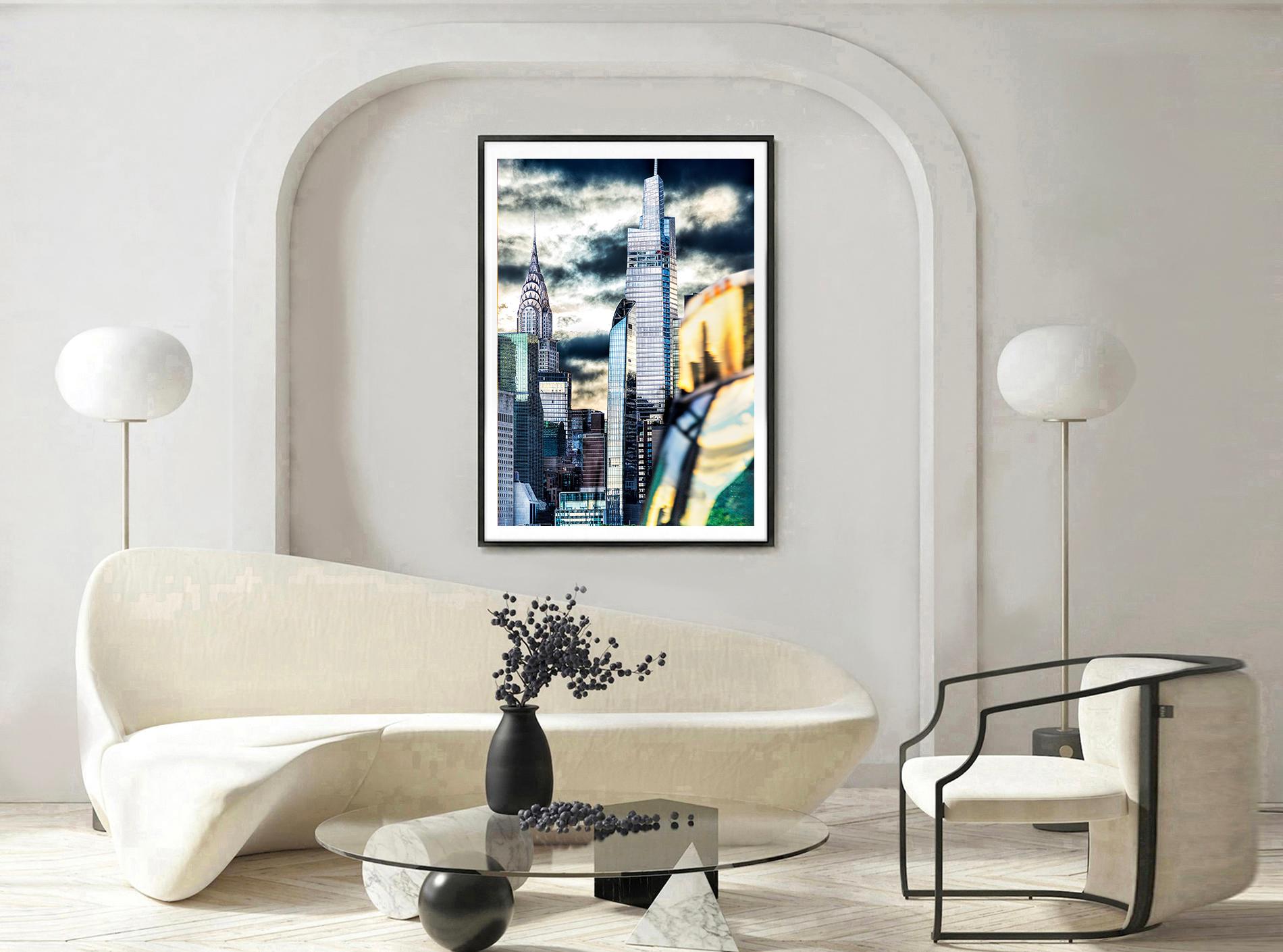 Veiled in subtle gradations of silver and grey, the Chrysler Building proudly rises above a tight interlocking formation of less consequential neighbors. A new, boxy, and clumsy vertical competitor, called One Vanderbilt, flanks the Art Deco icon to