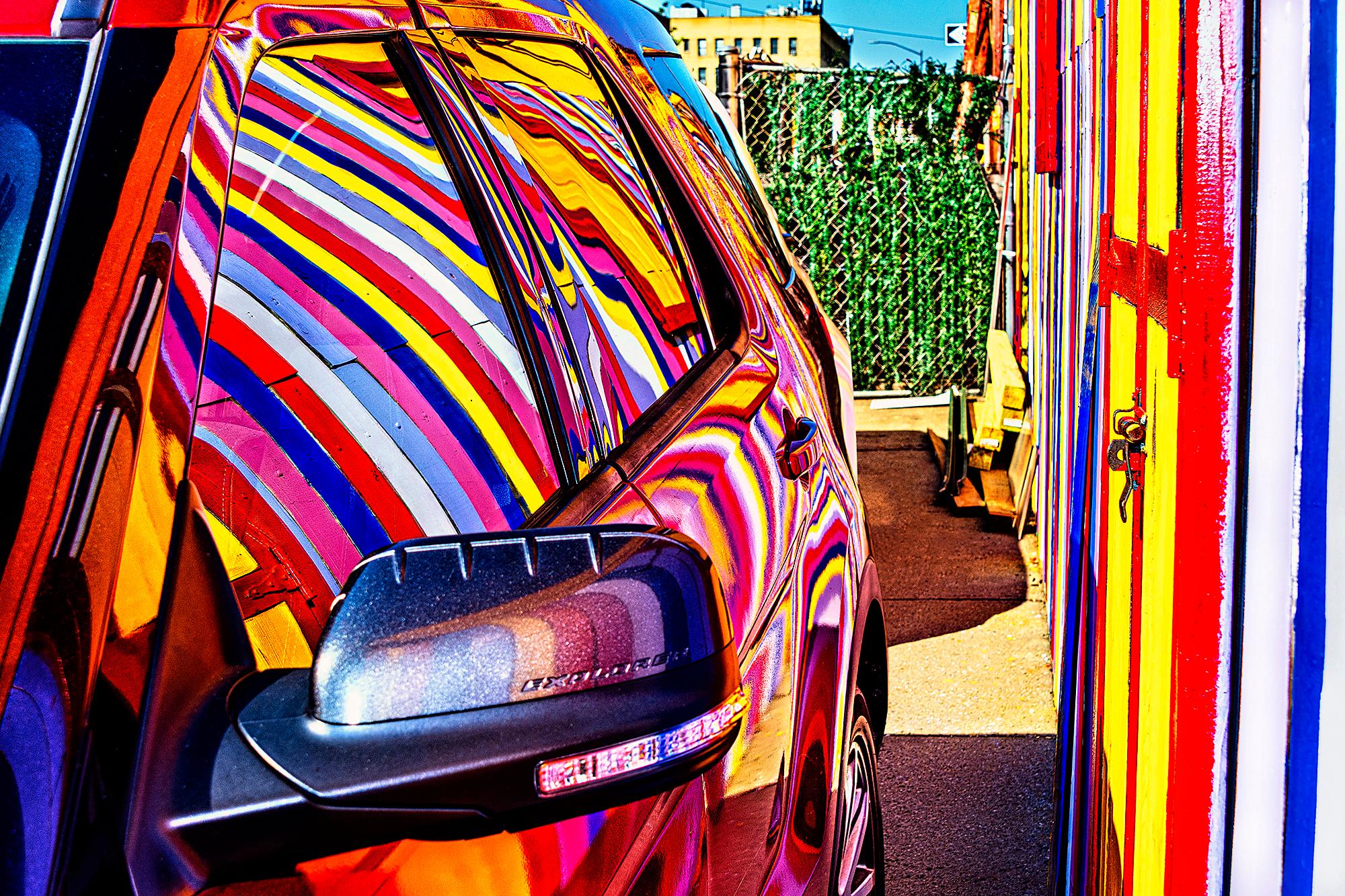 Colorful Street Art Reflected in Car