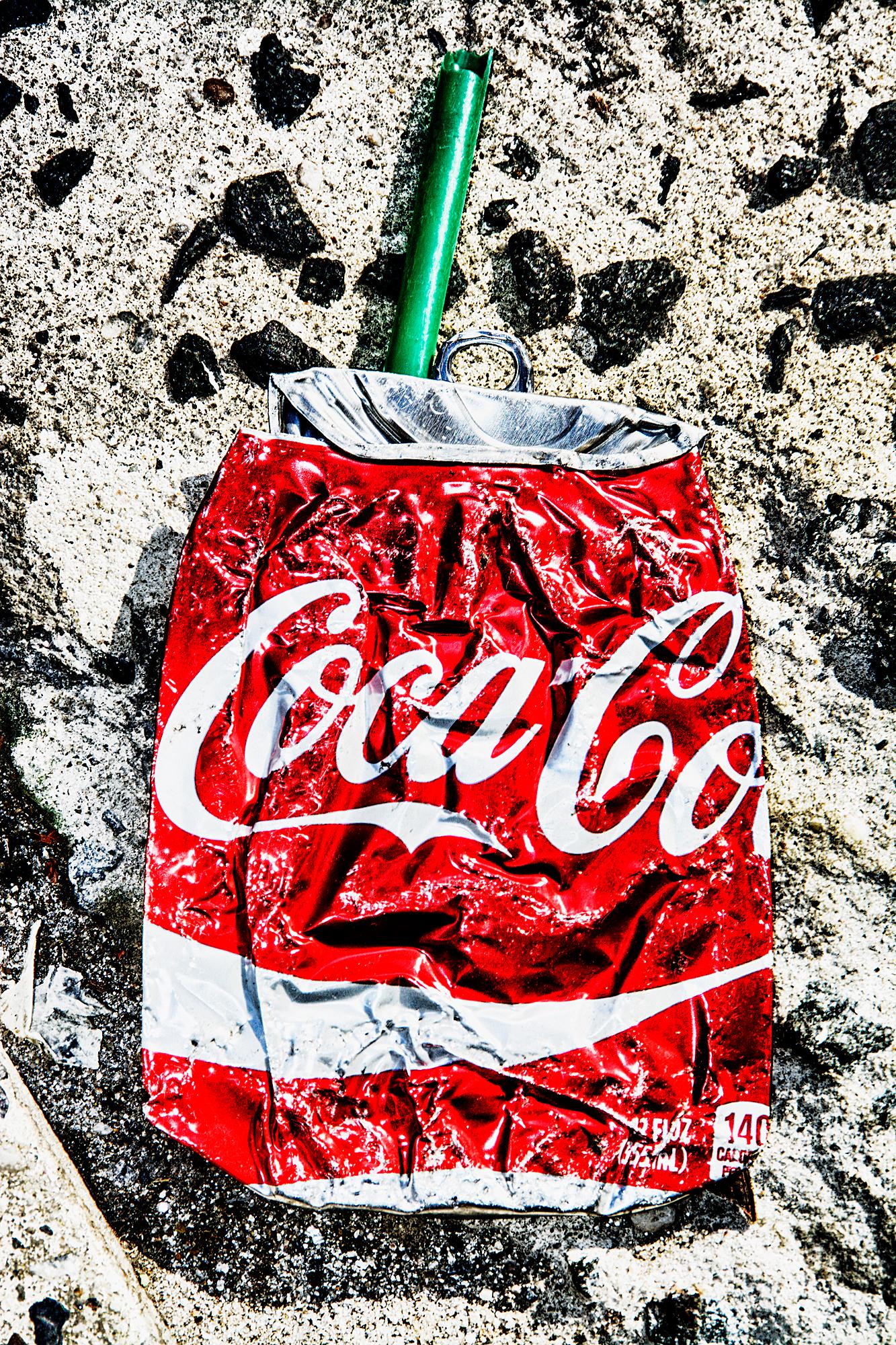 Mitchell Funk Abstract Photograph - Crushed Coke Can Street Asphalt - Real Life Street Art
