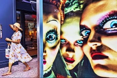 Double-take.  Street Photography with Eerie Blue Eyed Billboard