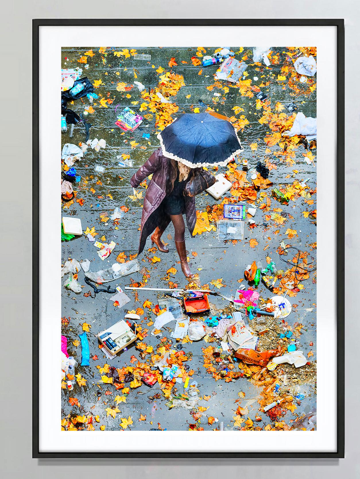 Elevated View Of Women With Umbrella Walking On Scattered Leaves - Photograph by Mitchell Funk