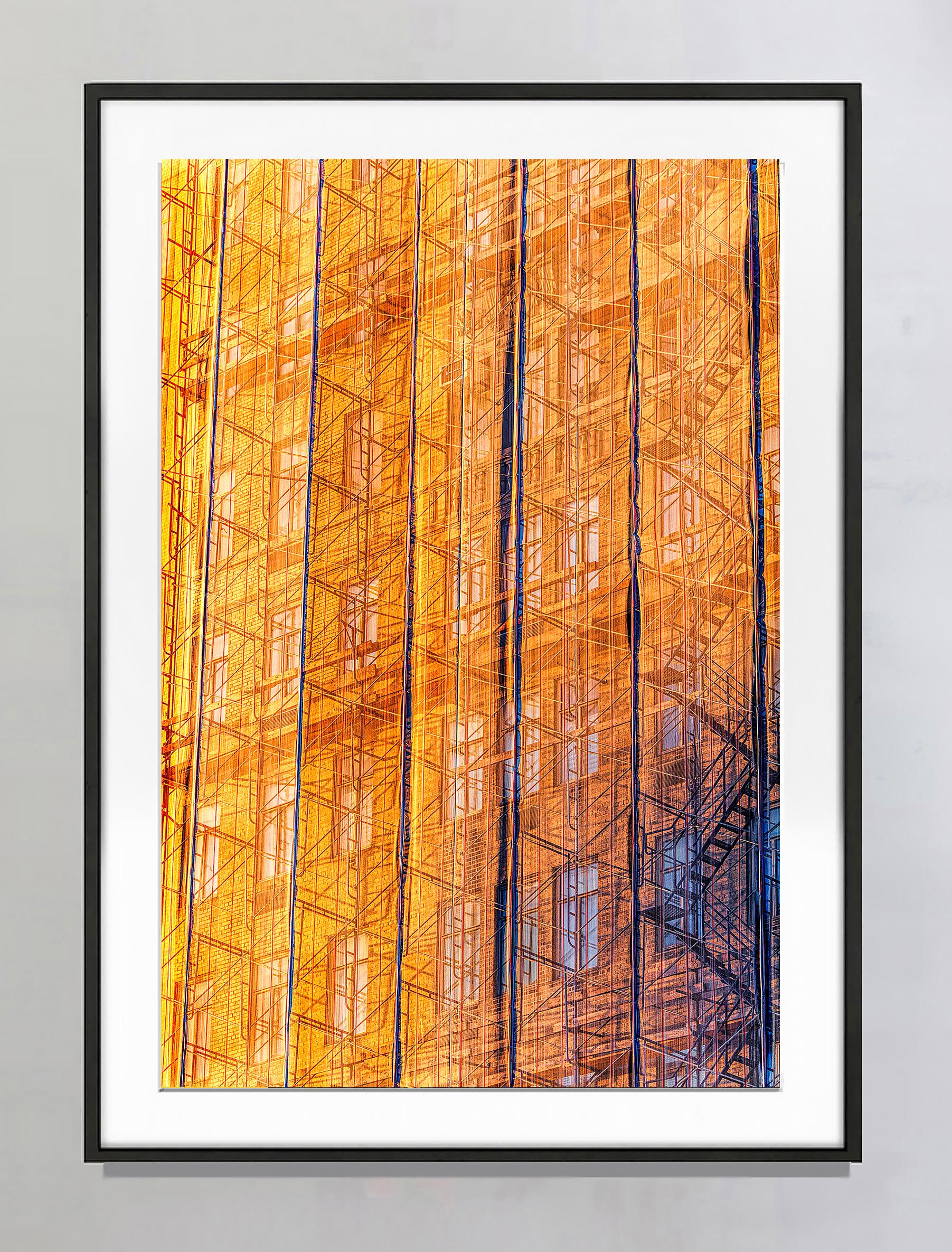Mitchell Funk follows the light.  Come along with him and become illuminated.  Ephemeral rays of golden light strike an Upper East Side pre-war facade under renovation. The resulting image pulsates with warm golds and oranges.   Funk has