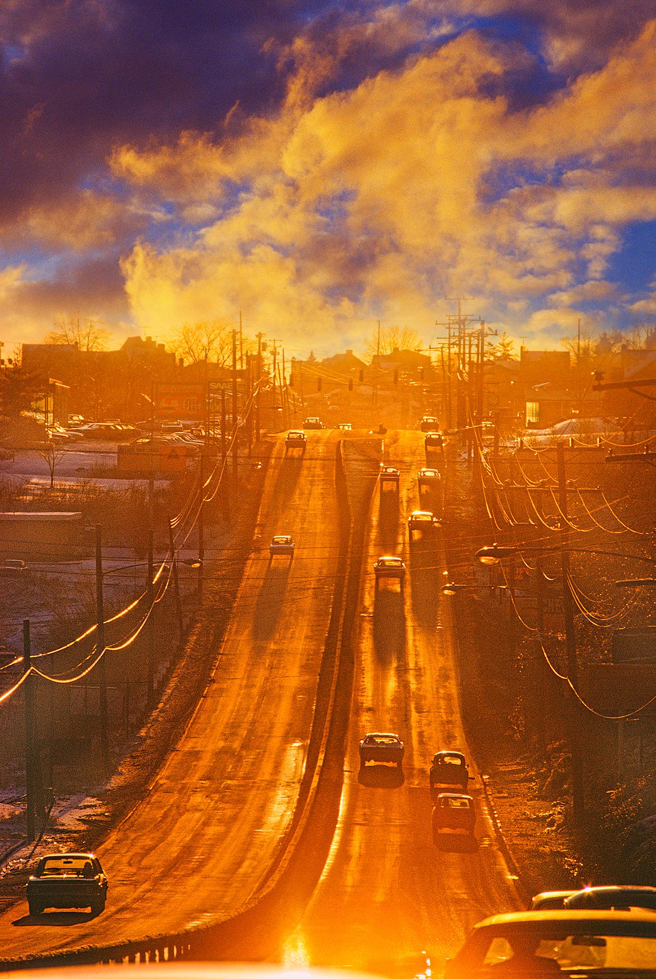 Landscape Photograph Mitchell Funk - Golden Light on 1970s Road - Photographie de rue : littéralement