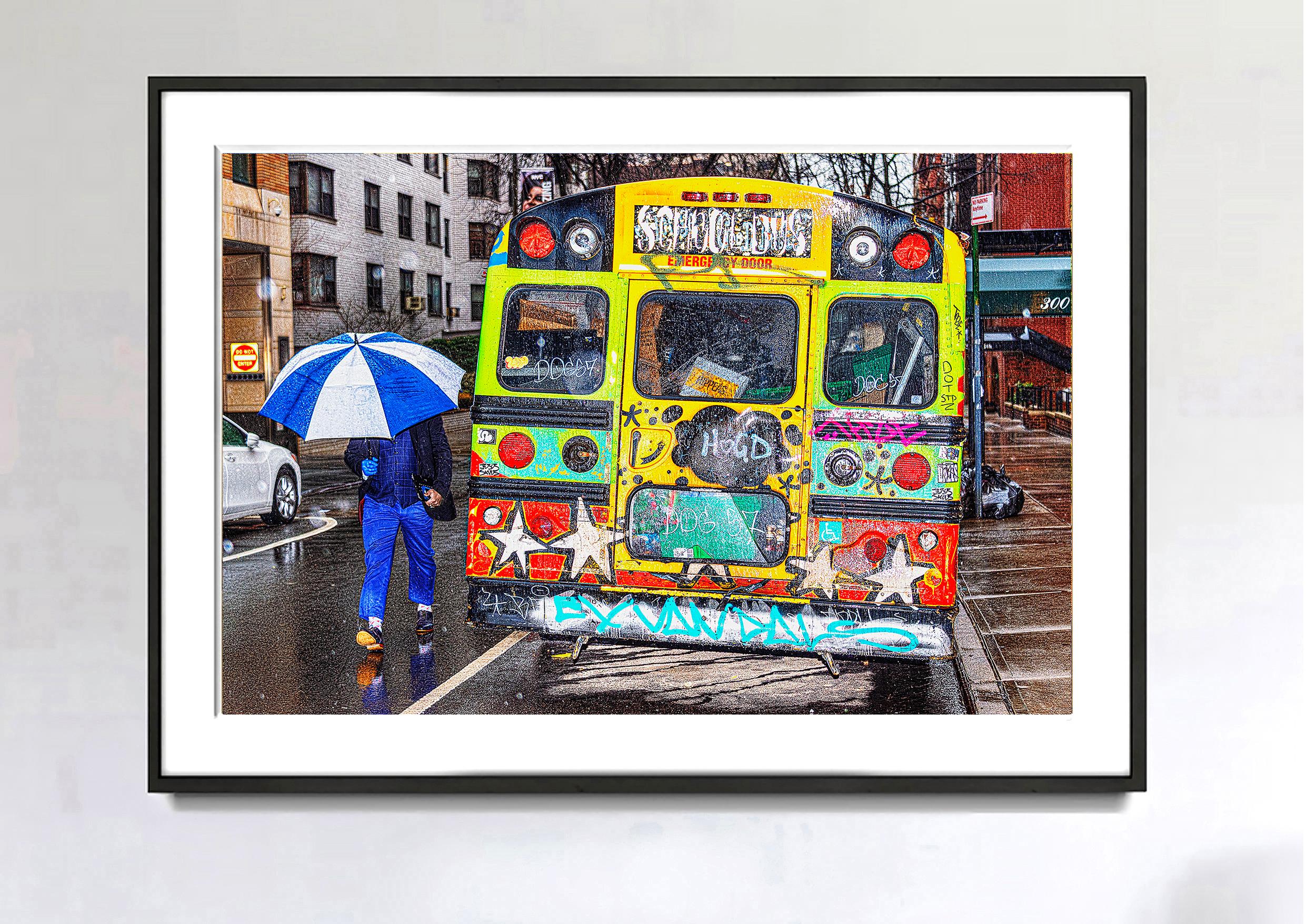 A Contrast of Two Art Styles - Graffiti Bus & Blue Umbrella on Rainy Day  - Photograph by Mitchell Funk