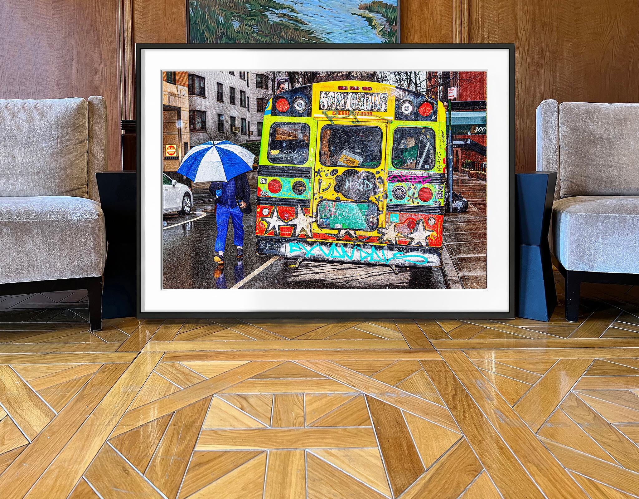 A Contrast of Two Art Styles - Graffiti Bus & Blue Umbrella on Rainy Day  - Abstract Expressionist Photograph by Mitchell Funk