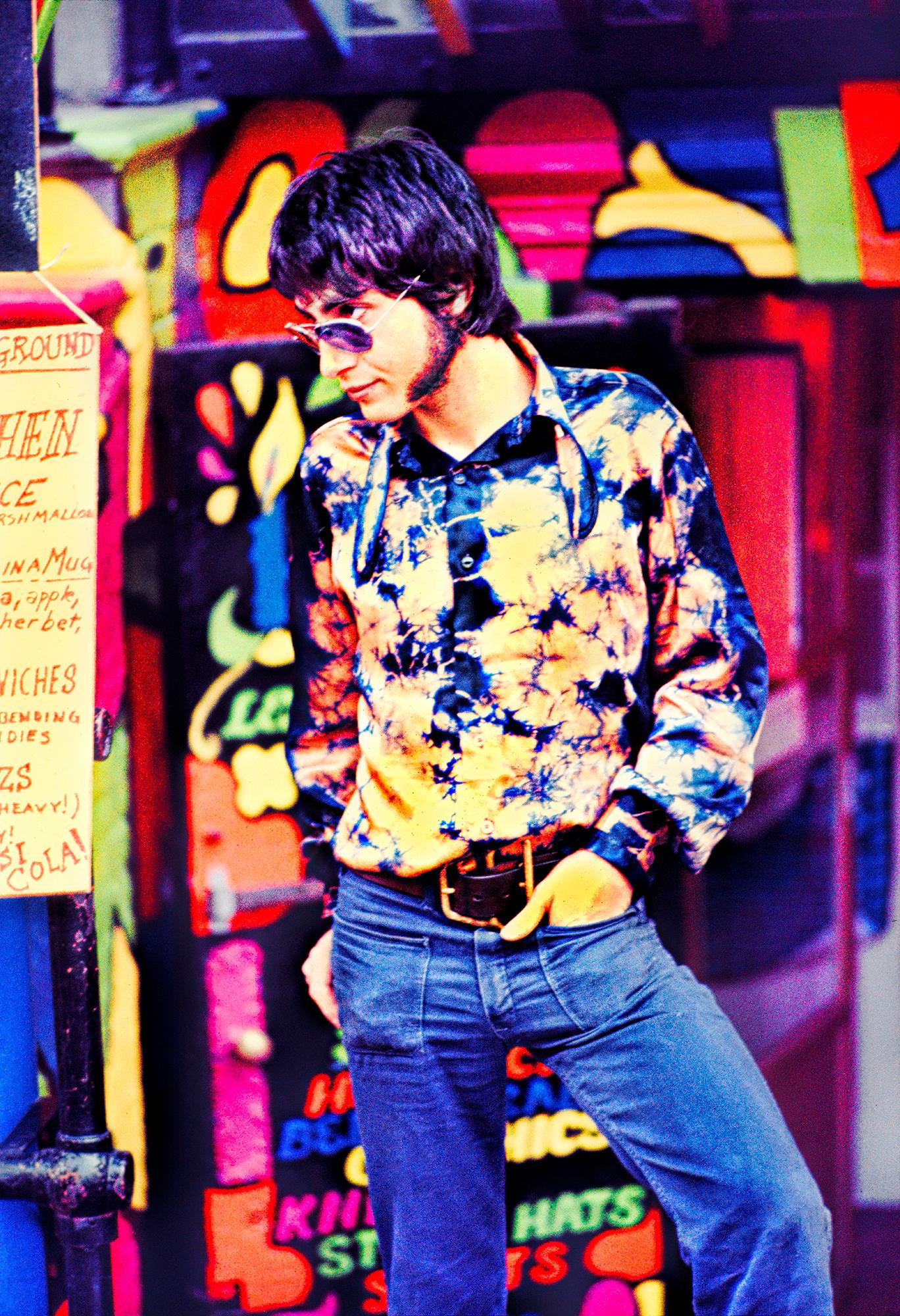 Mitchell Funk Color Photograph - Groovy Portrait. Hippy at Psychedelic Head Shop St. Mark's Place, East Village