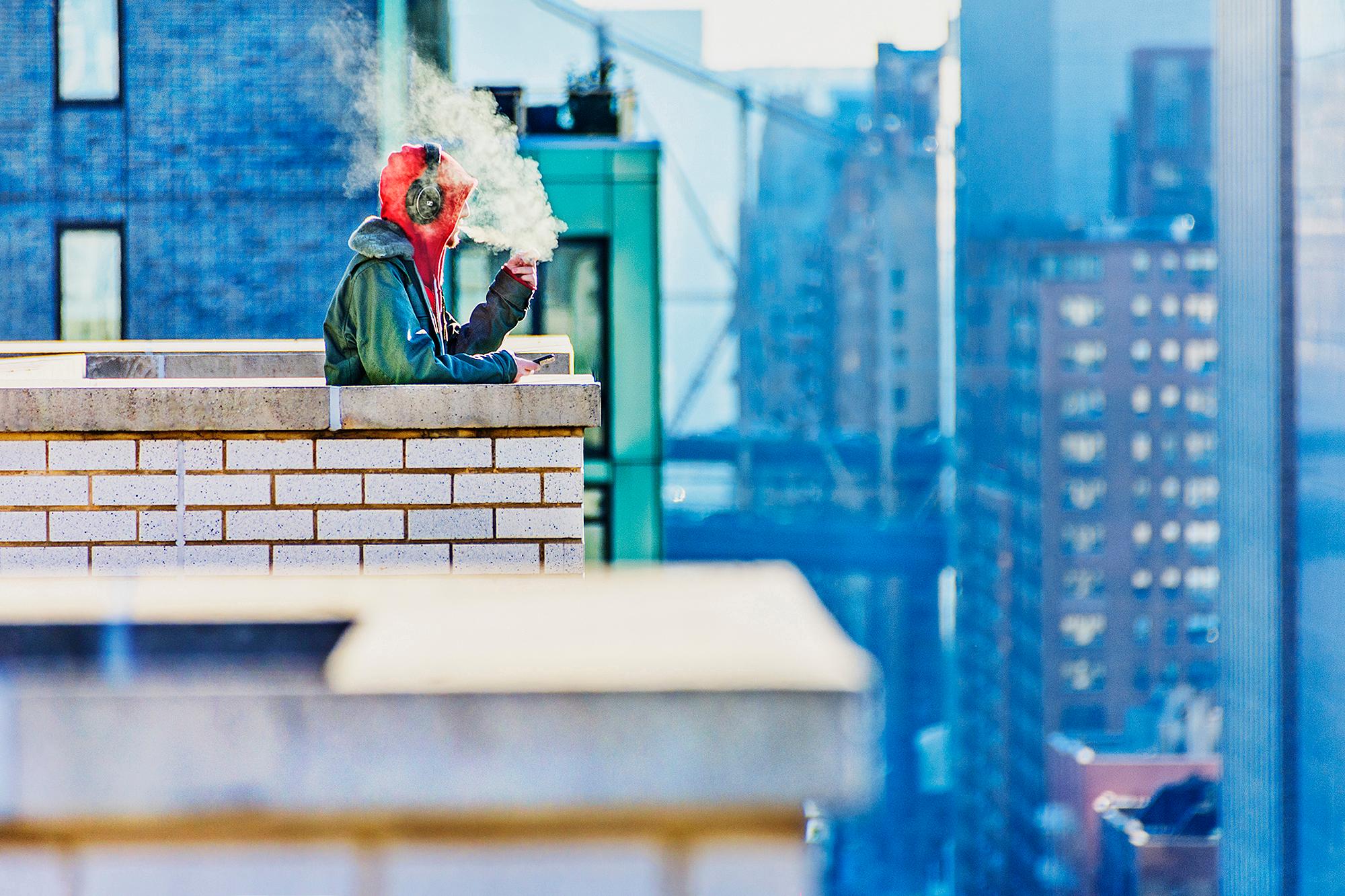 Mitchell Funk Figurative Photograph - High in the City ( Blowing Smoke and Vaping Upper East Side  ) 