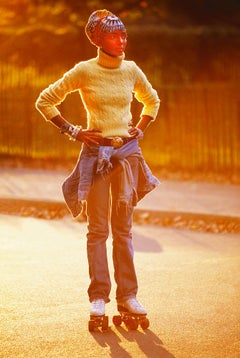 Retro Hip Beautiful Black Female Roller Skates in Central Park Soaked in Golden Light 