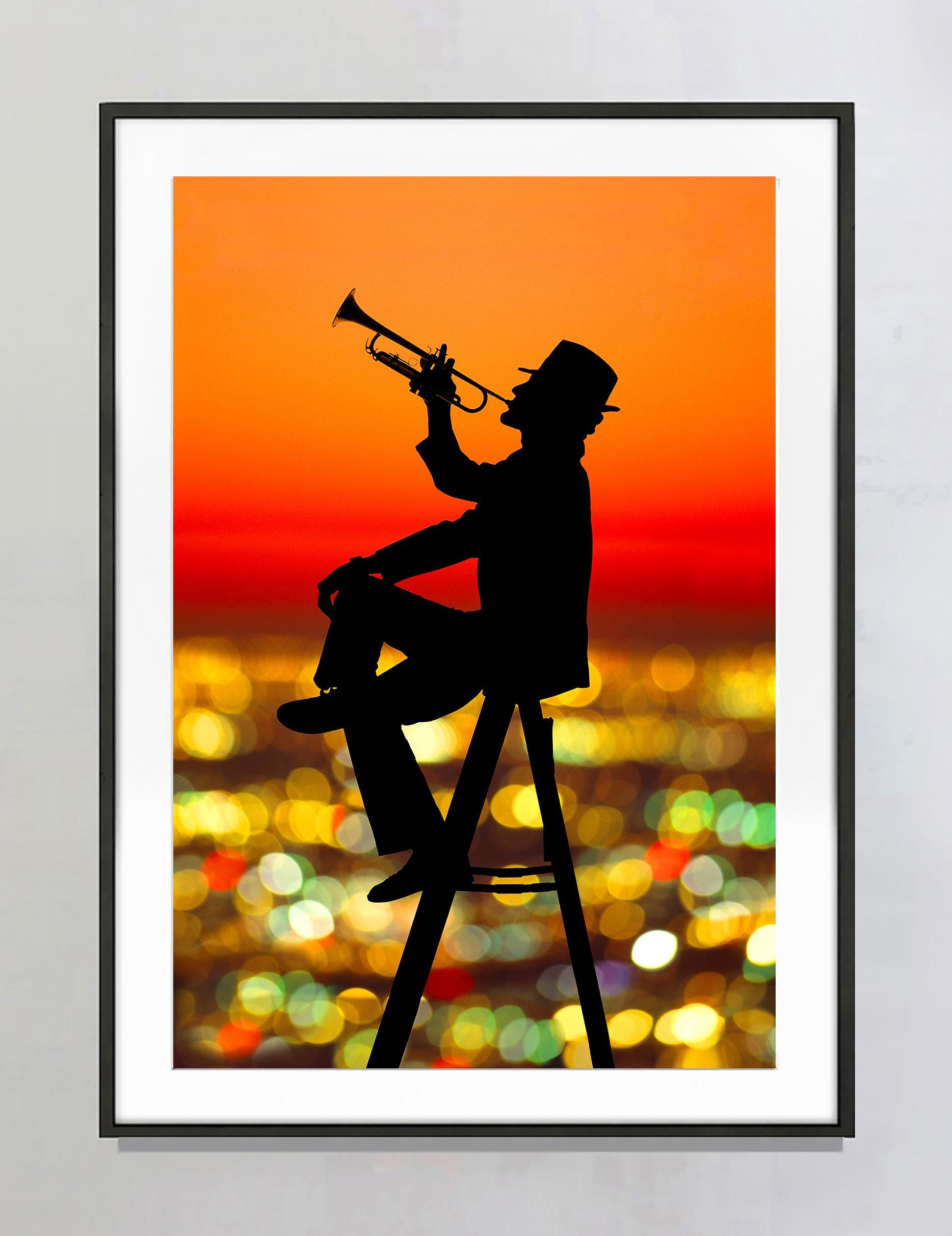 Joyful Jazz Trumpet Player in Silhouette Floating  Orange Sunset Los Angeles - Photograph by Mitchell Funk