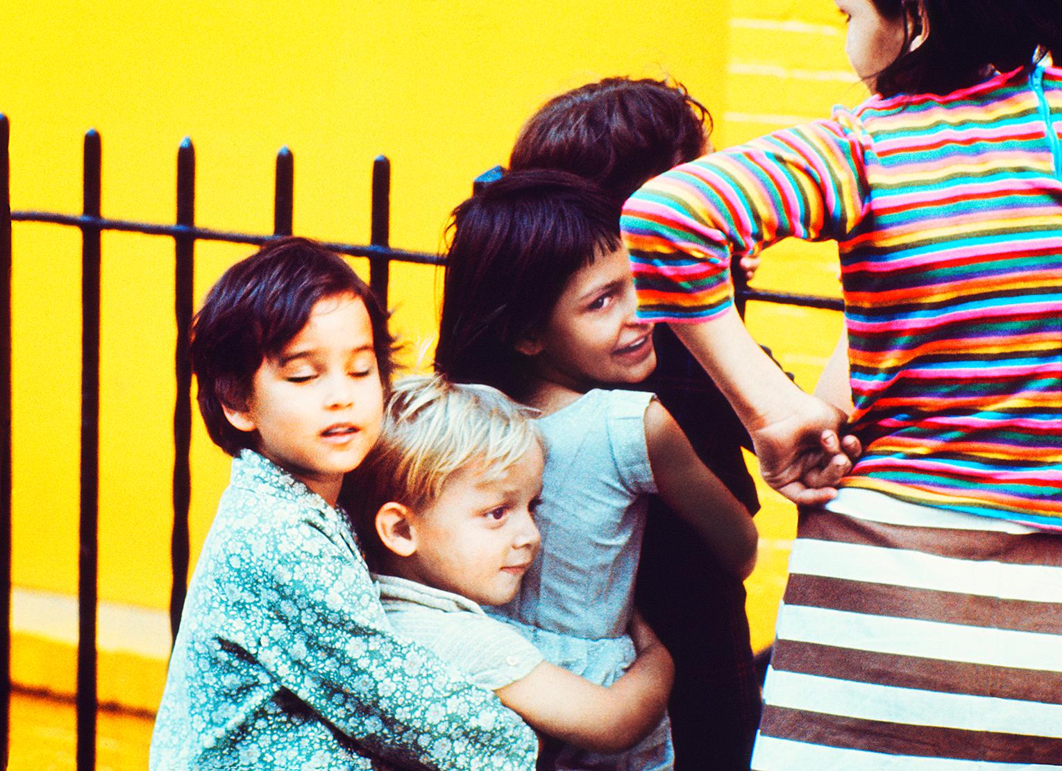 Kids having Fun in front East Village Yellow Wall, Street Photography in Color 