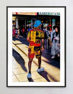 Man in Colorful African Theme Clothes Illuminated by Shaft of Light