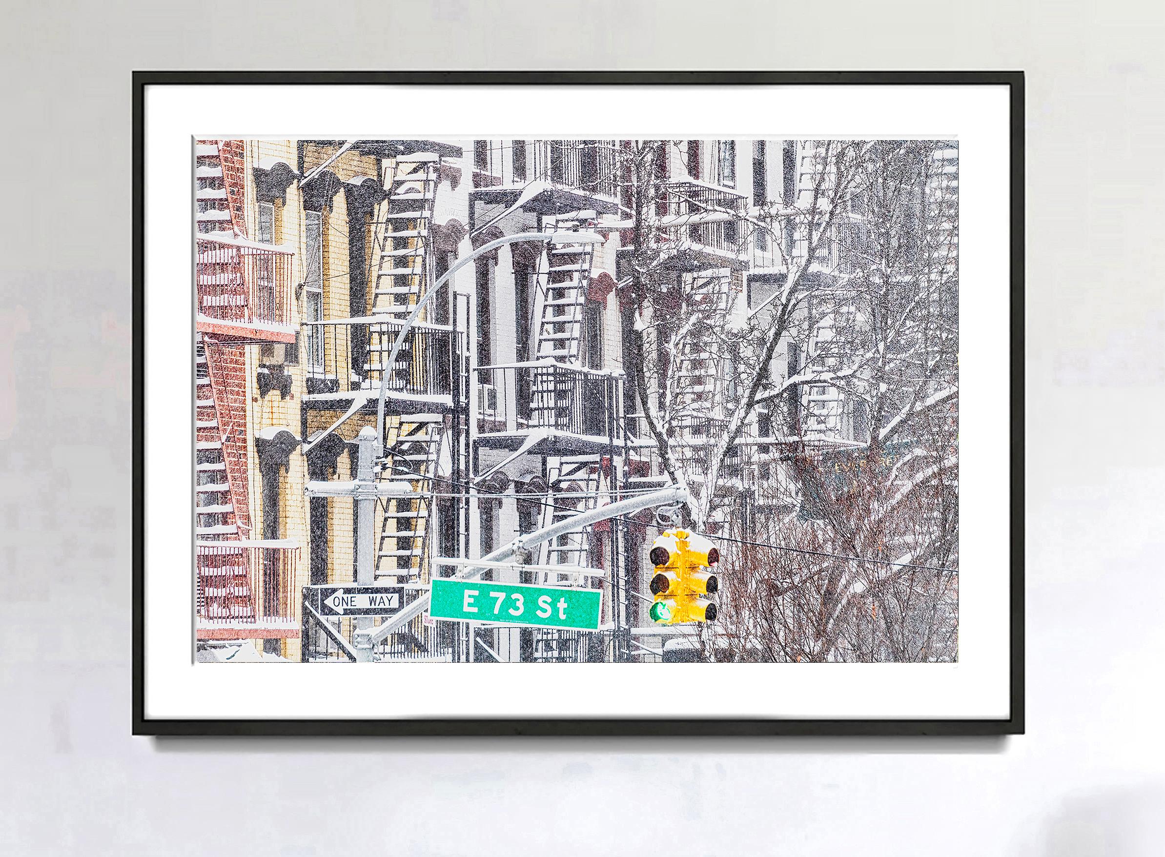 A New York City snowstorm allows Street Photographer Mitchell Funk to transform facades of Upper Eastside walkups into a stunning impressionist cityscape. Monochromatic grays are punctuated by punchy dayglow colors of a street sign and a street
