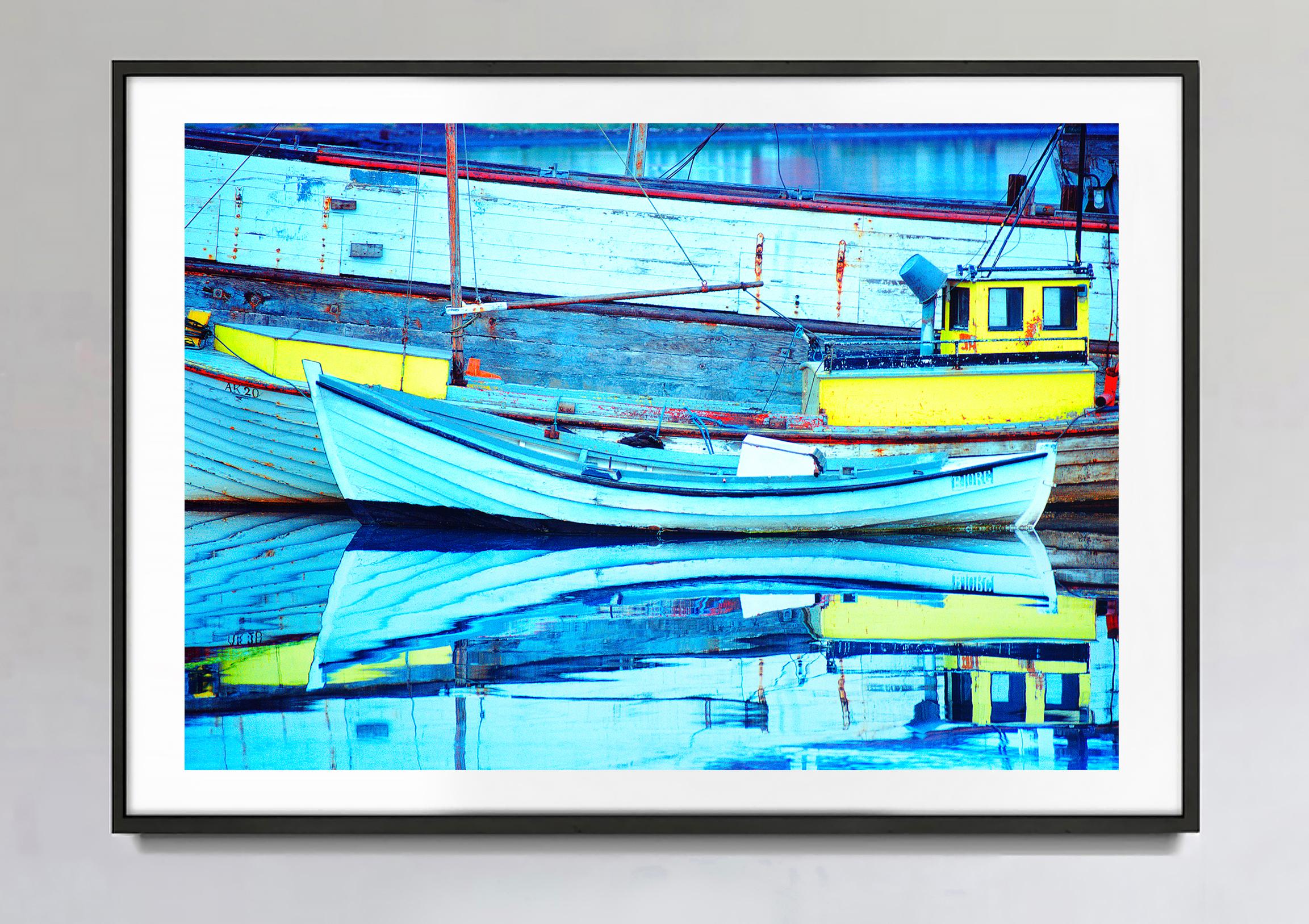 Old Boats In Iceland With Blue Reflections In Water, Abstract - Photograph by Mitchell Funk