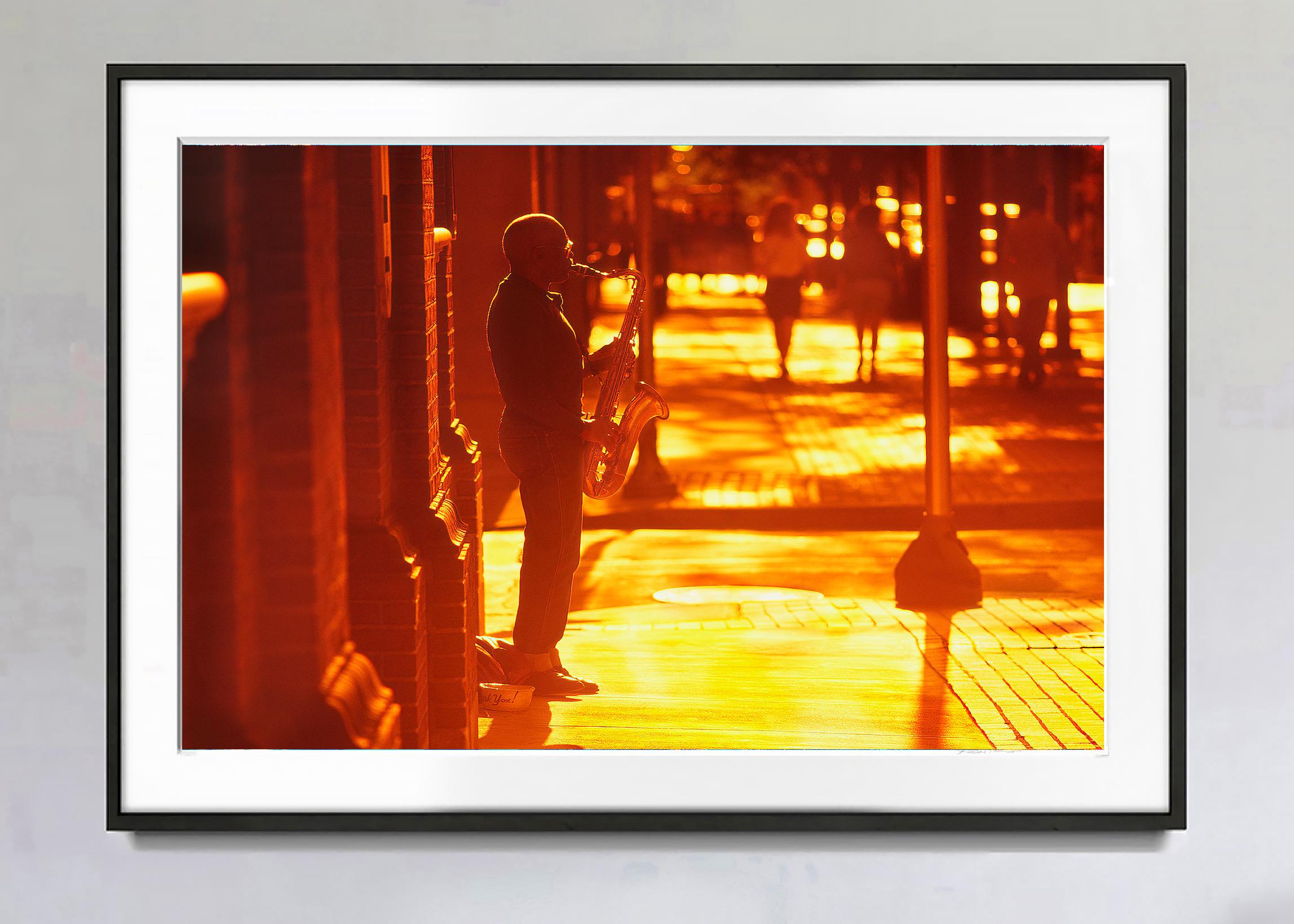 Romantic Street Musician Playing the Saxophone in Golden Light and Orange - Photograph by Mitchell Funk