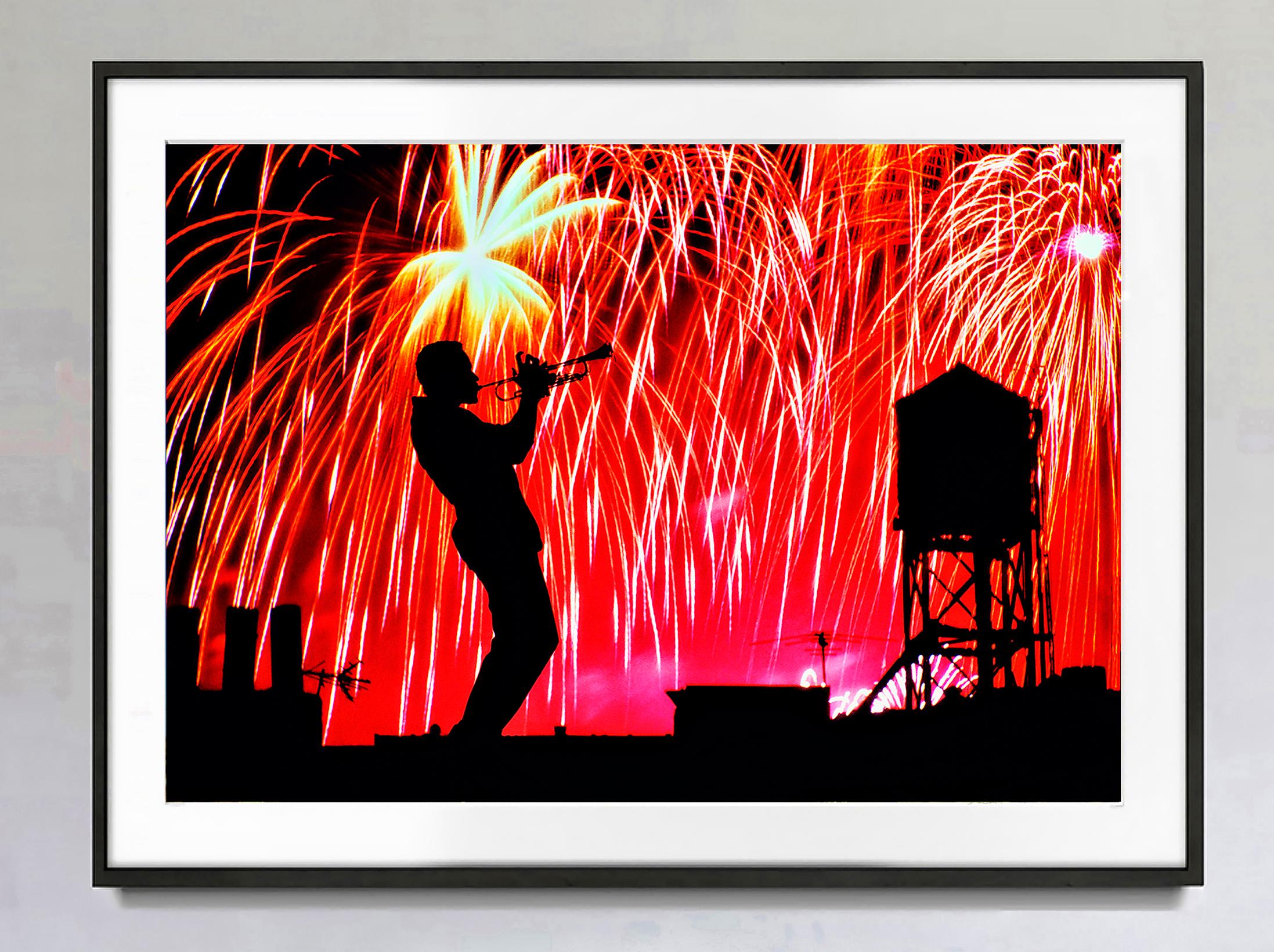 Roof Top Jazz Trumpet Player Celebration of Life,  Fireworks in New York - Photograph by Mitchell Funk