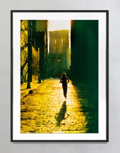 Floating Runner Glides Above Dumbo Cobblestone in Angelic Light
