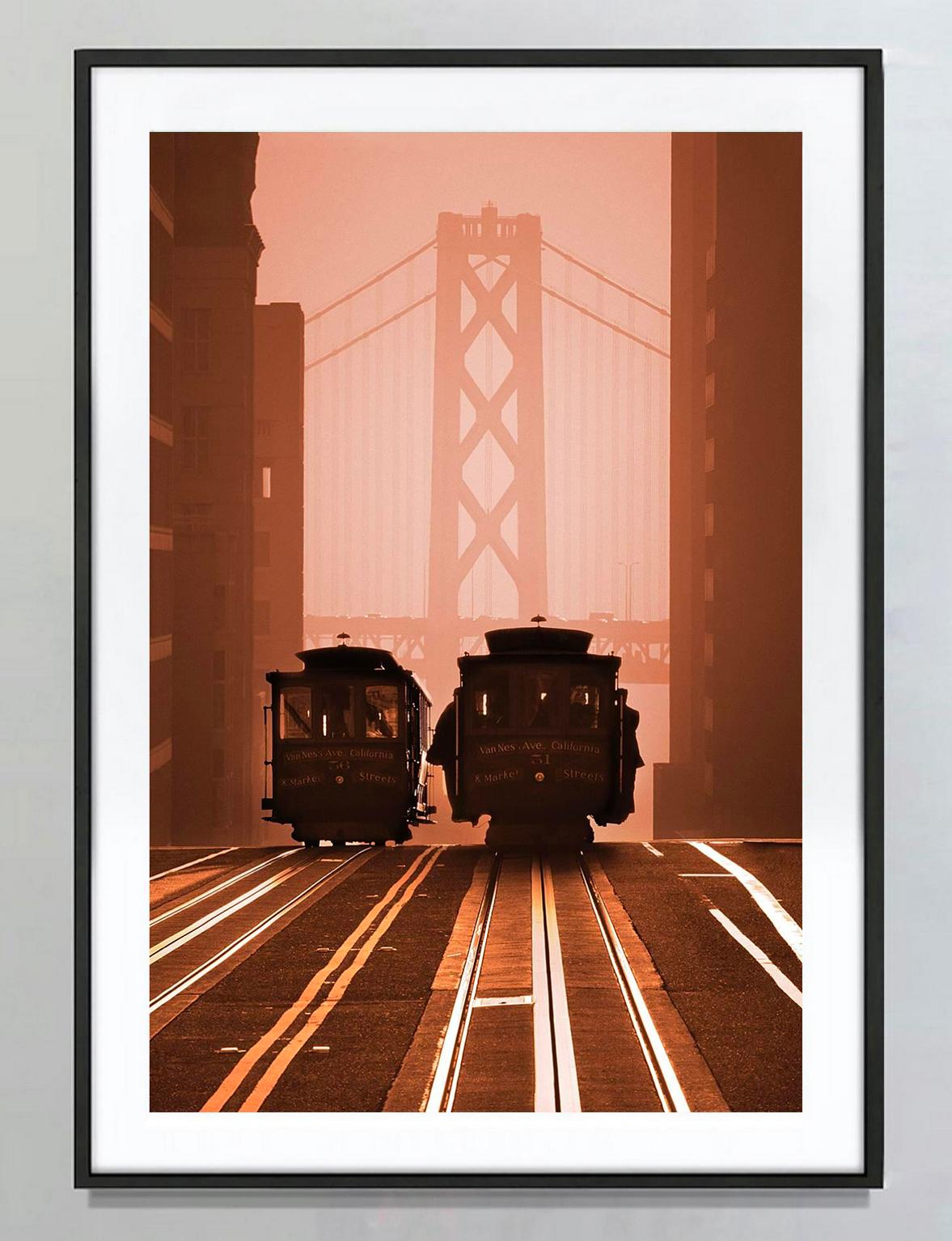 San Francisco Cable Cars Landscape against Bay Bridge - Photograph by Mitchell Funk