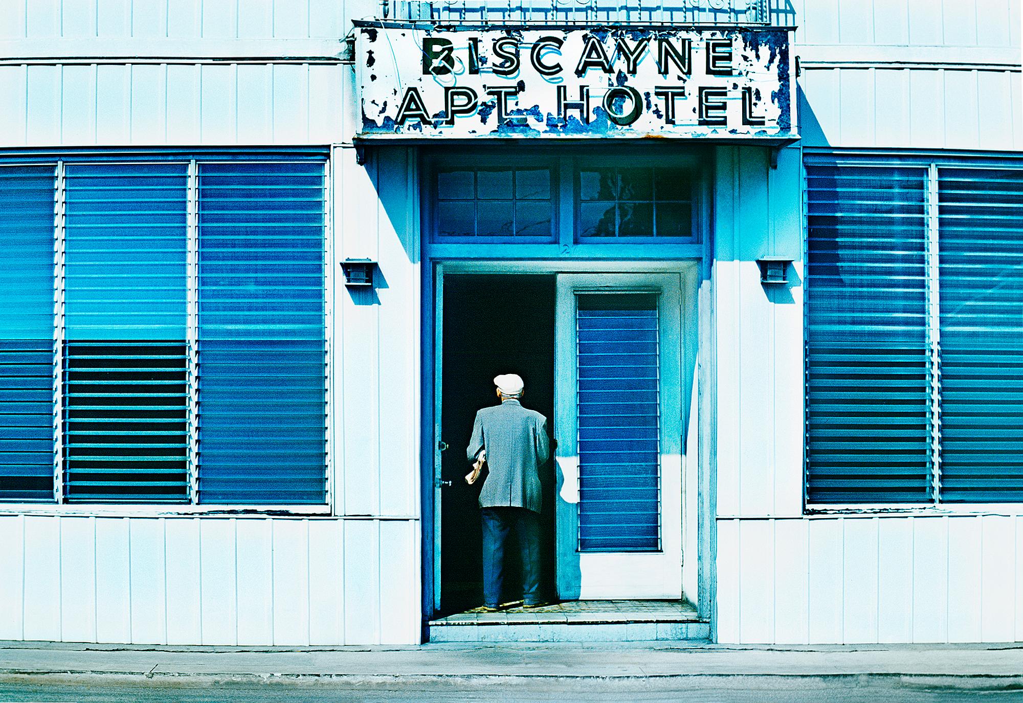 Mitchell Funk Portrait Photograph - South Beach in the 1970s. Old Man Walking Enters Building - Old Miami Beach