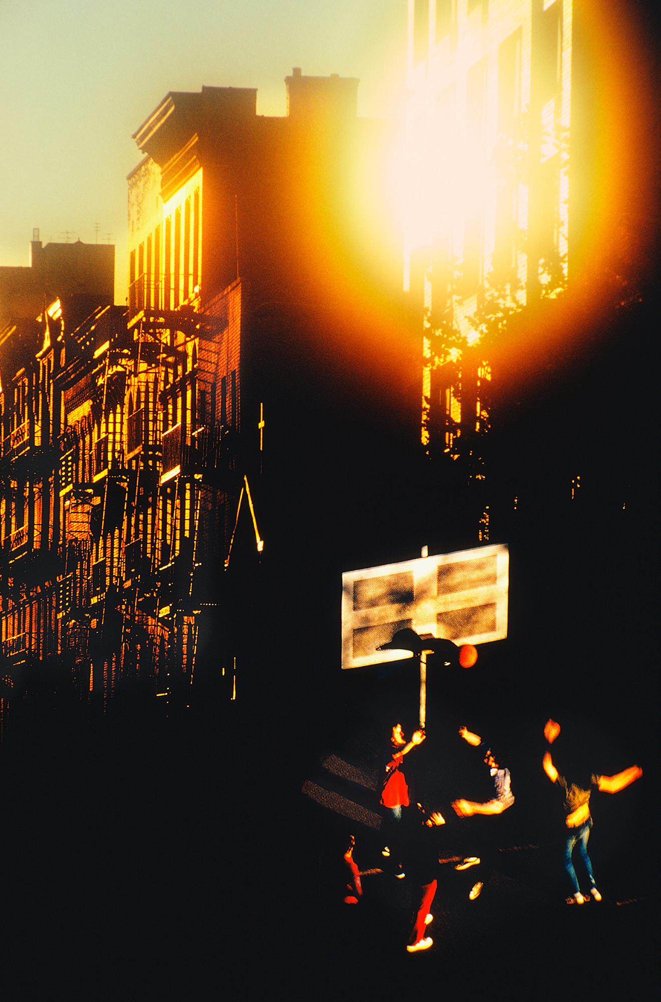 Mitchell Funk Figurative Photograph - Street Basketball with Angelic Light Burst in Gold