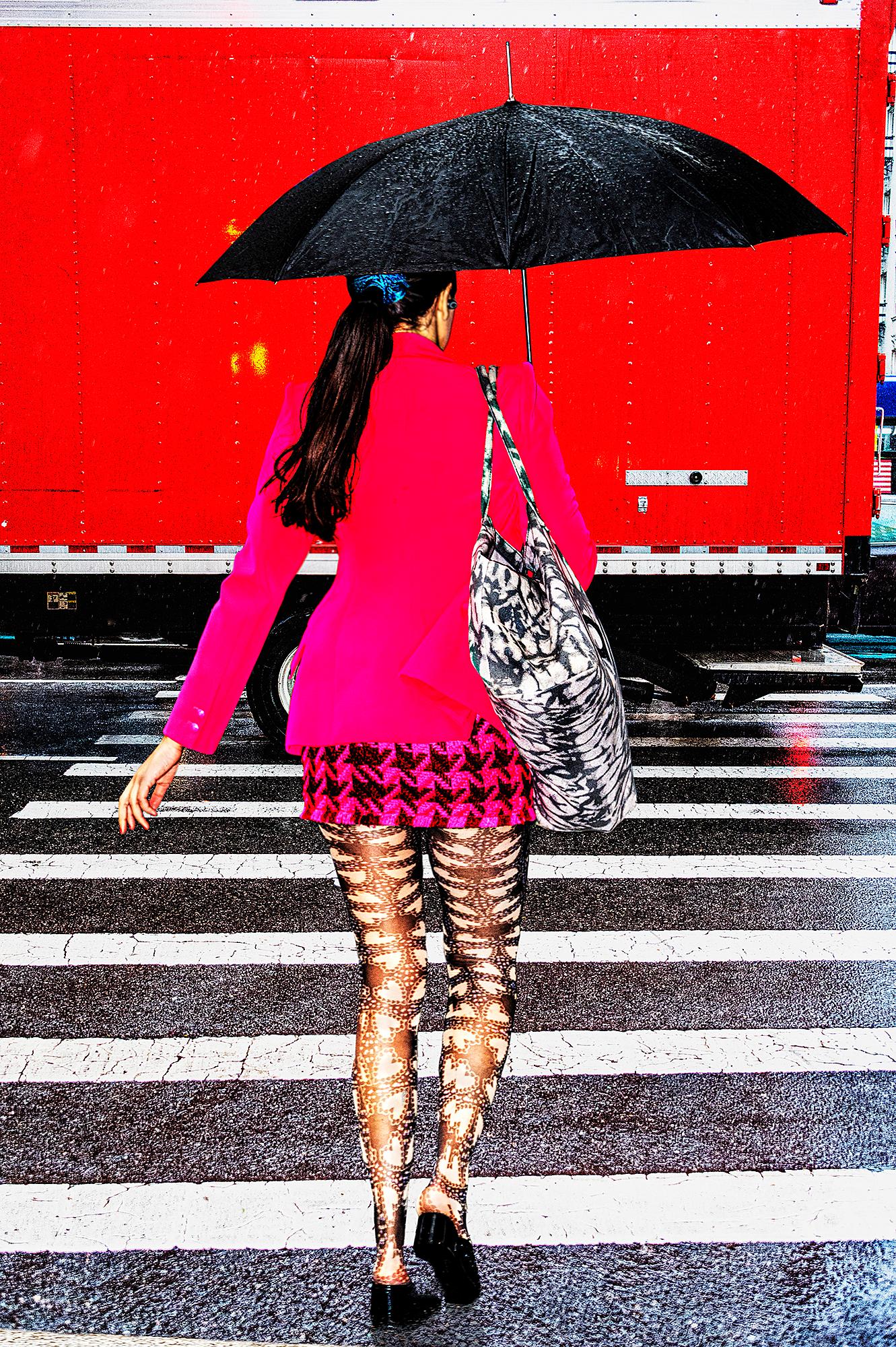 Street Fashionista in Pink Ensemble on New York City Rainy Day 