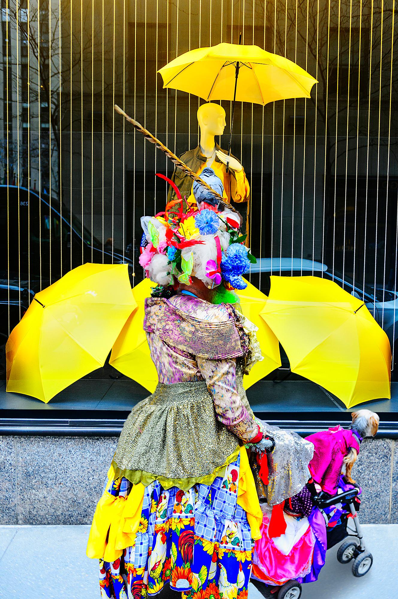 Mitchell Funk Portrait Photograph - Street Photography of  Eccentric Women with Colorful Cloths and Yellow Umbrellas