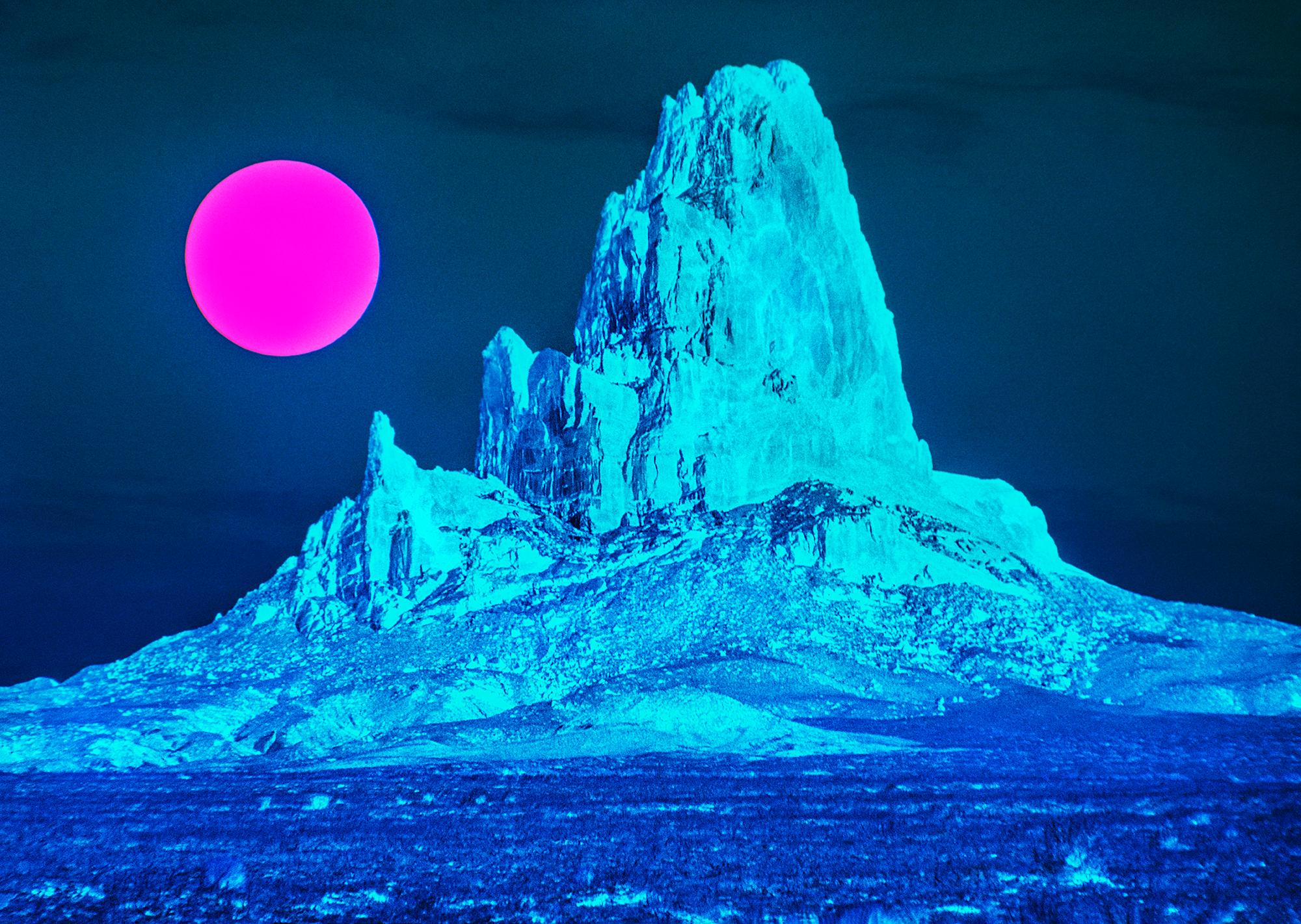 Mitchell Funk Landscape Photograph - Surreal Desert Landscape with Blue Mountain and Magenta Moon - Monument Valley 