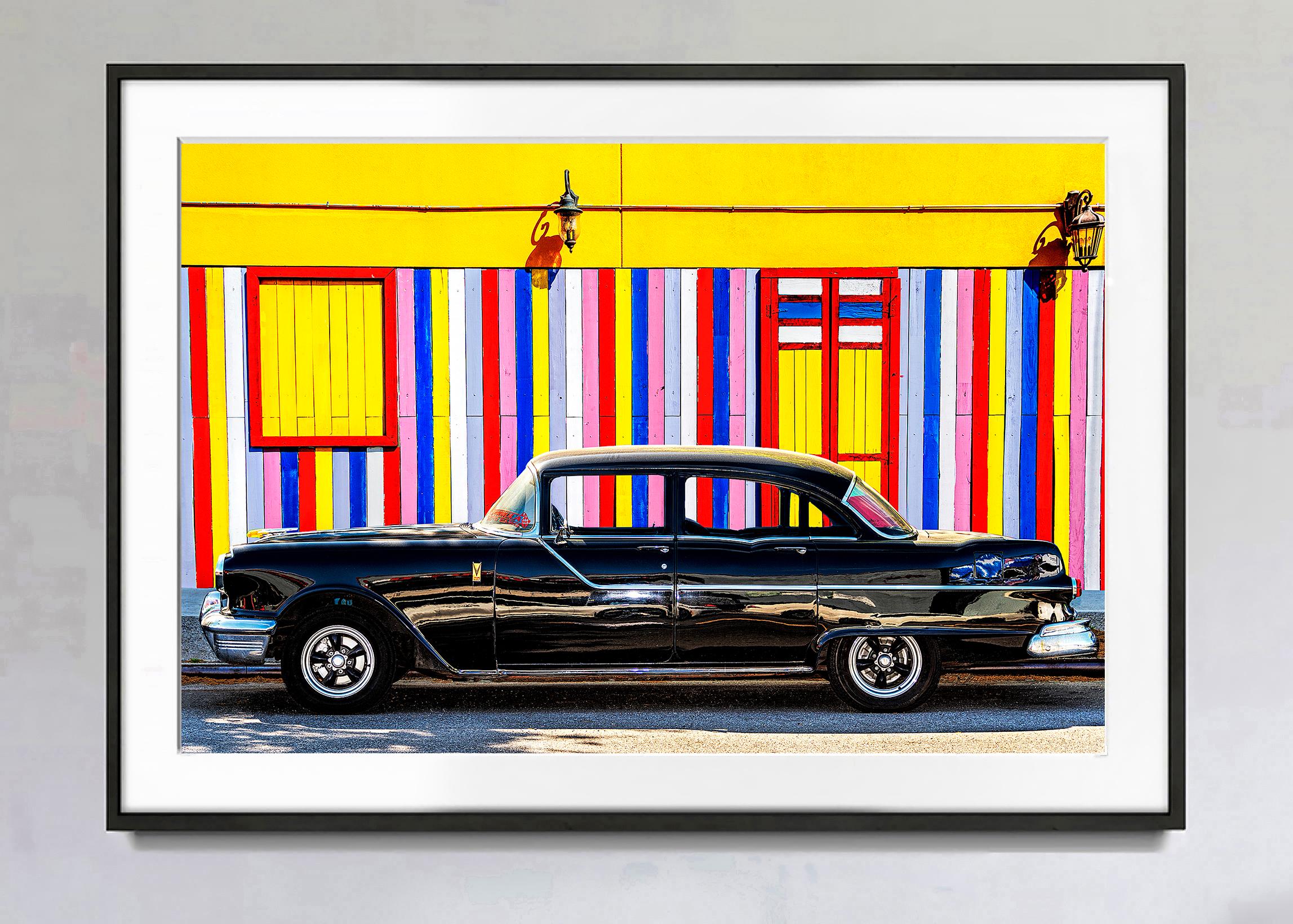 Vintage Car Against Colorful Striped  Yellow Wall   - Primary Colors - Photograph by Mitchell Funk