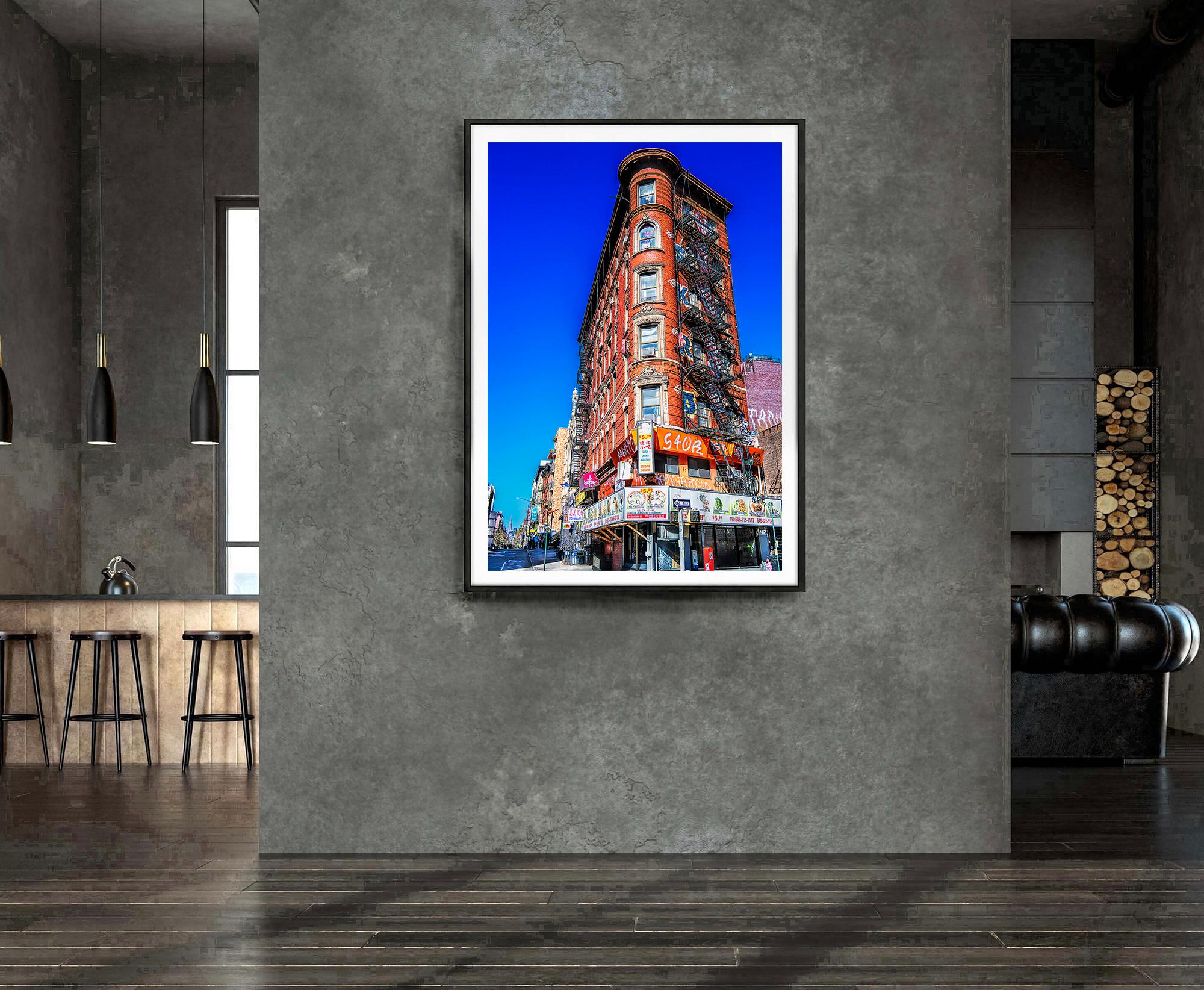 Although minuscule within the image's pictorial space, the Chrysler Building is still quite visible even from Eldridge Street in the Lower East Side. This is accomplished through the two-point perspective's powerful diagonal elements, which lead the