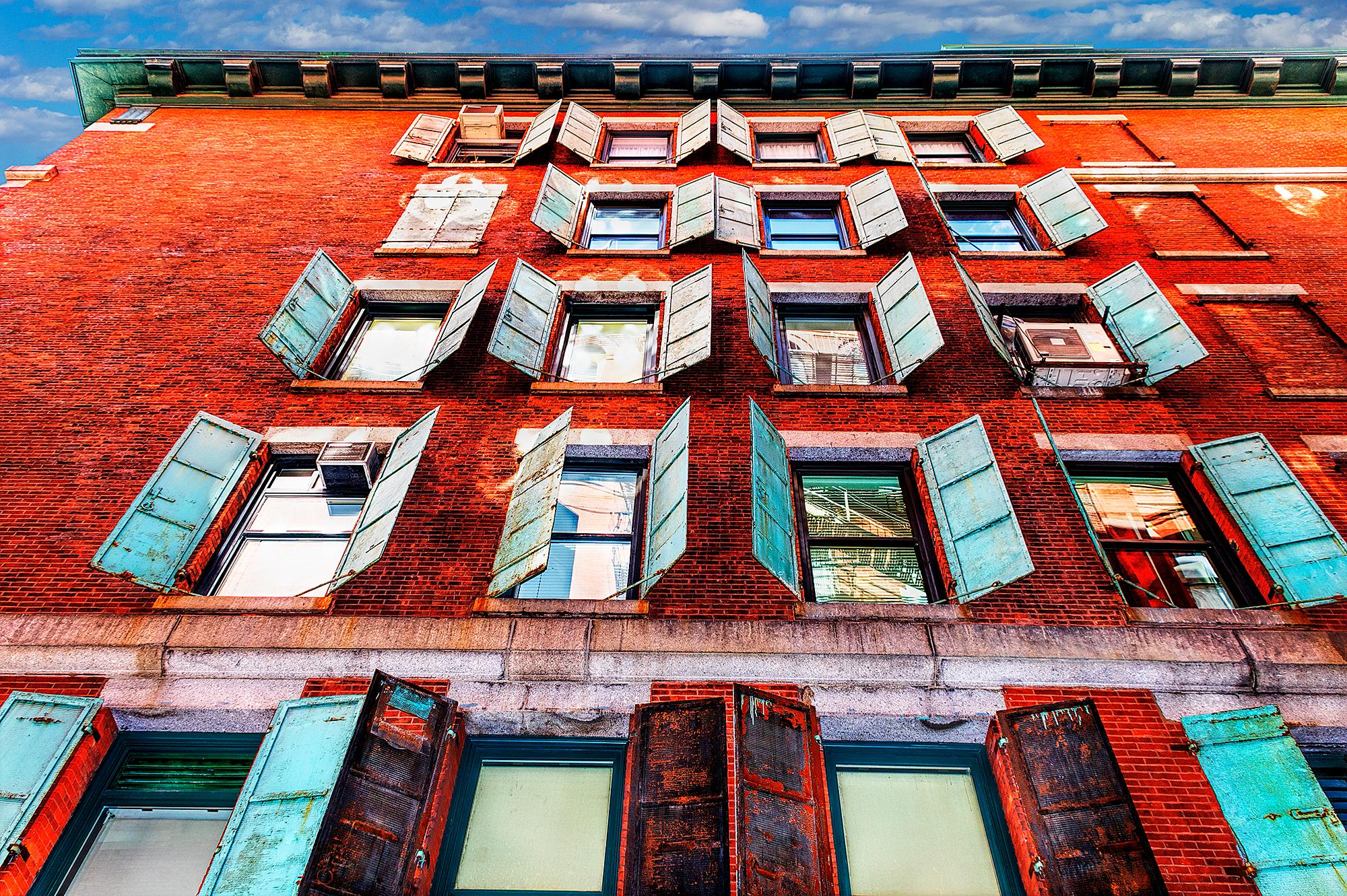Windows with open shutters lower Manhattan