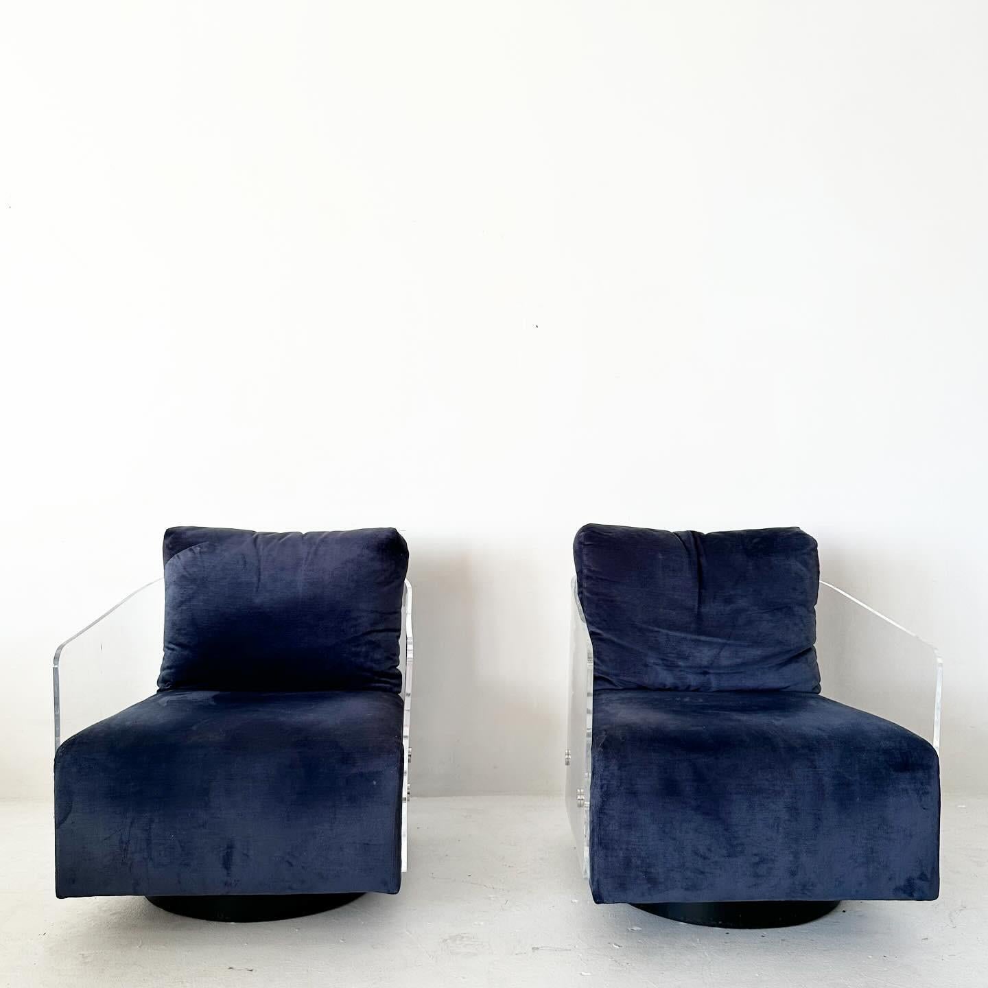 Pair of blue velvet Mitchell Gold & Bob Williams Lucite Lucy Swivel Blue Club Lounge Chairs. Purchased from original owner in an estate sale.

1970s inspired, made in early 2000s. Very well constructed and comfy.

Inquire if you are interested in