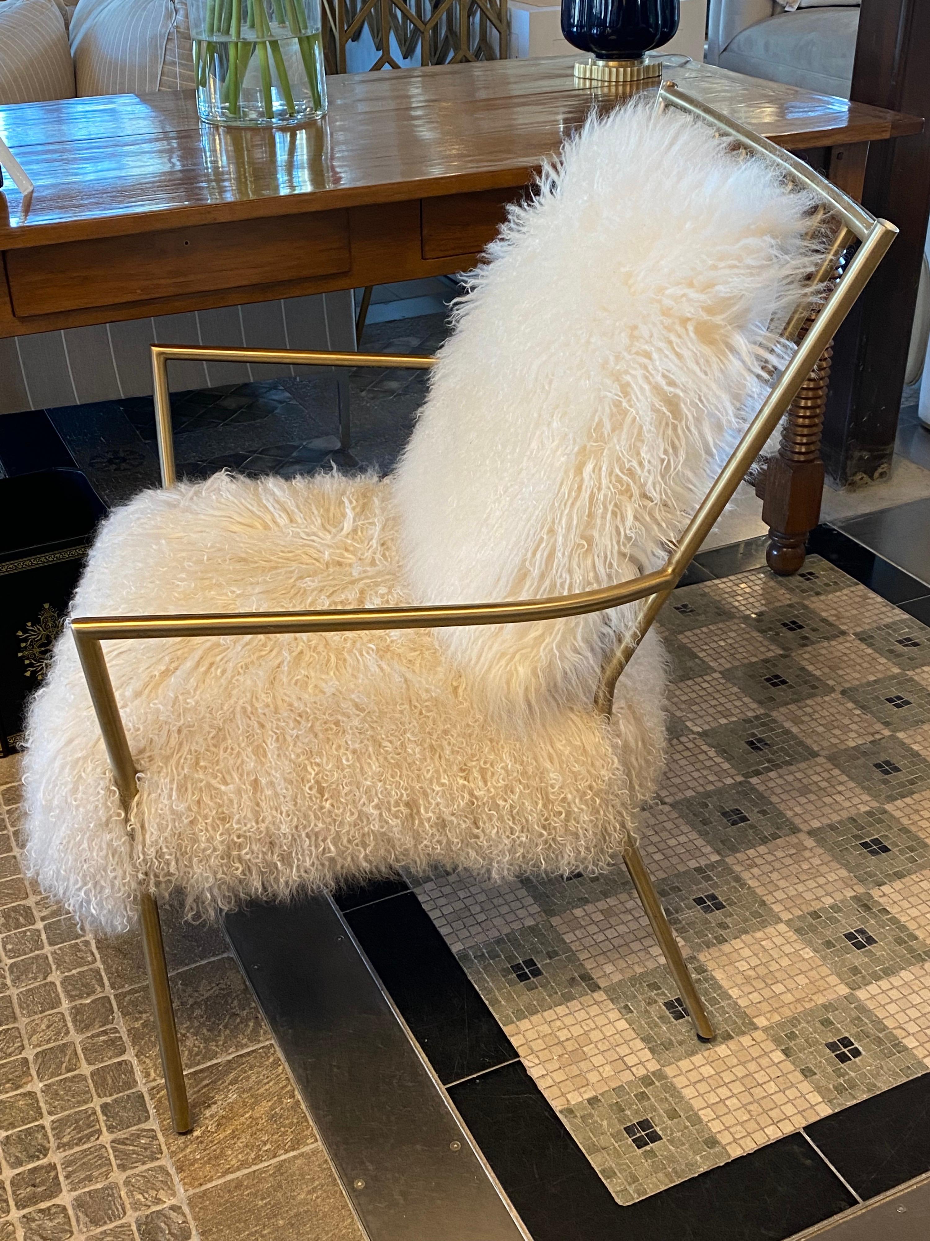 Mitchell Gold Mongolian sheepskin chair with gold frame

Measures: 27