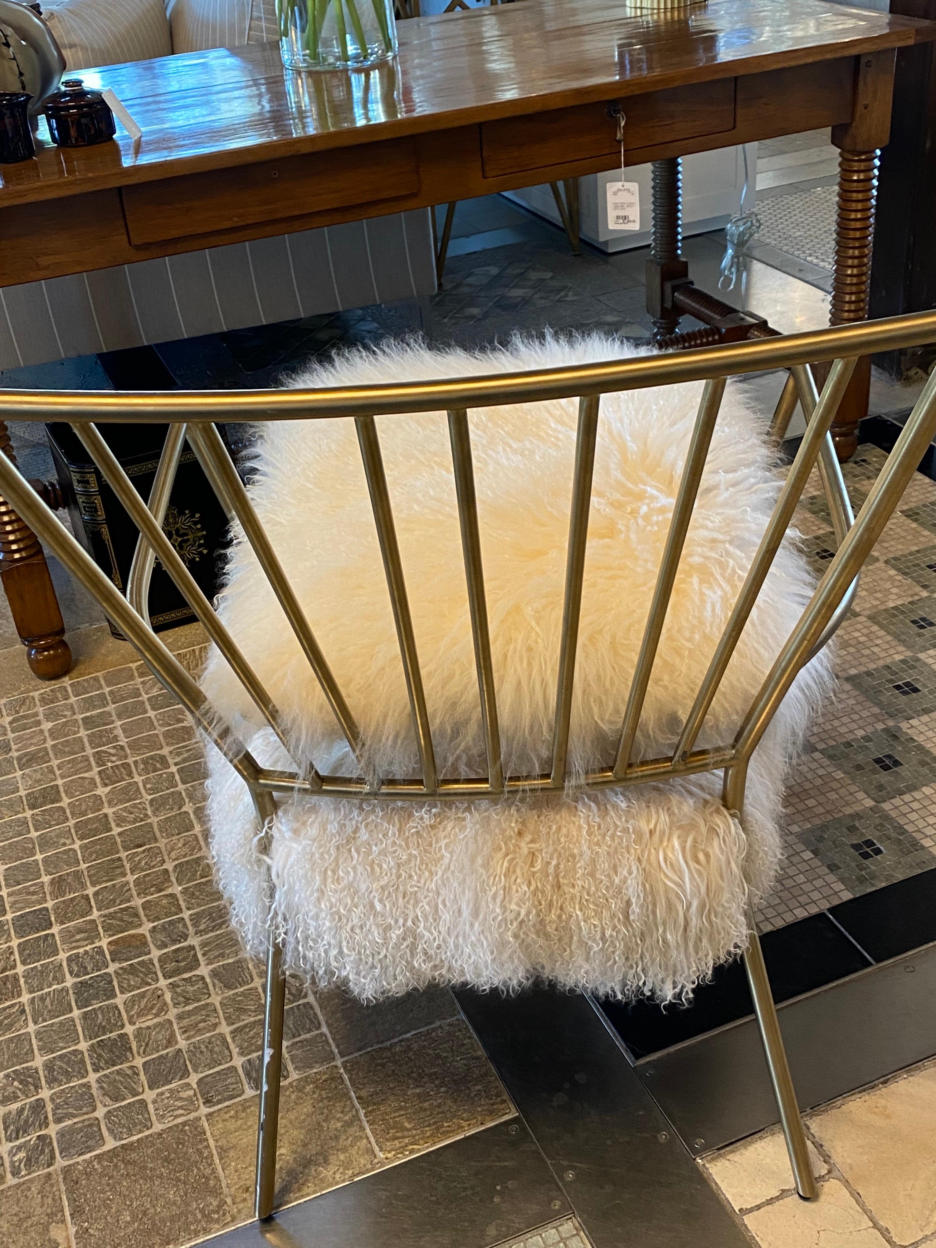 white fur chair with gold legs