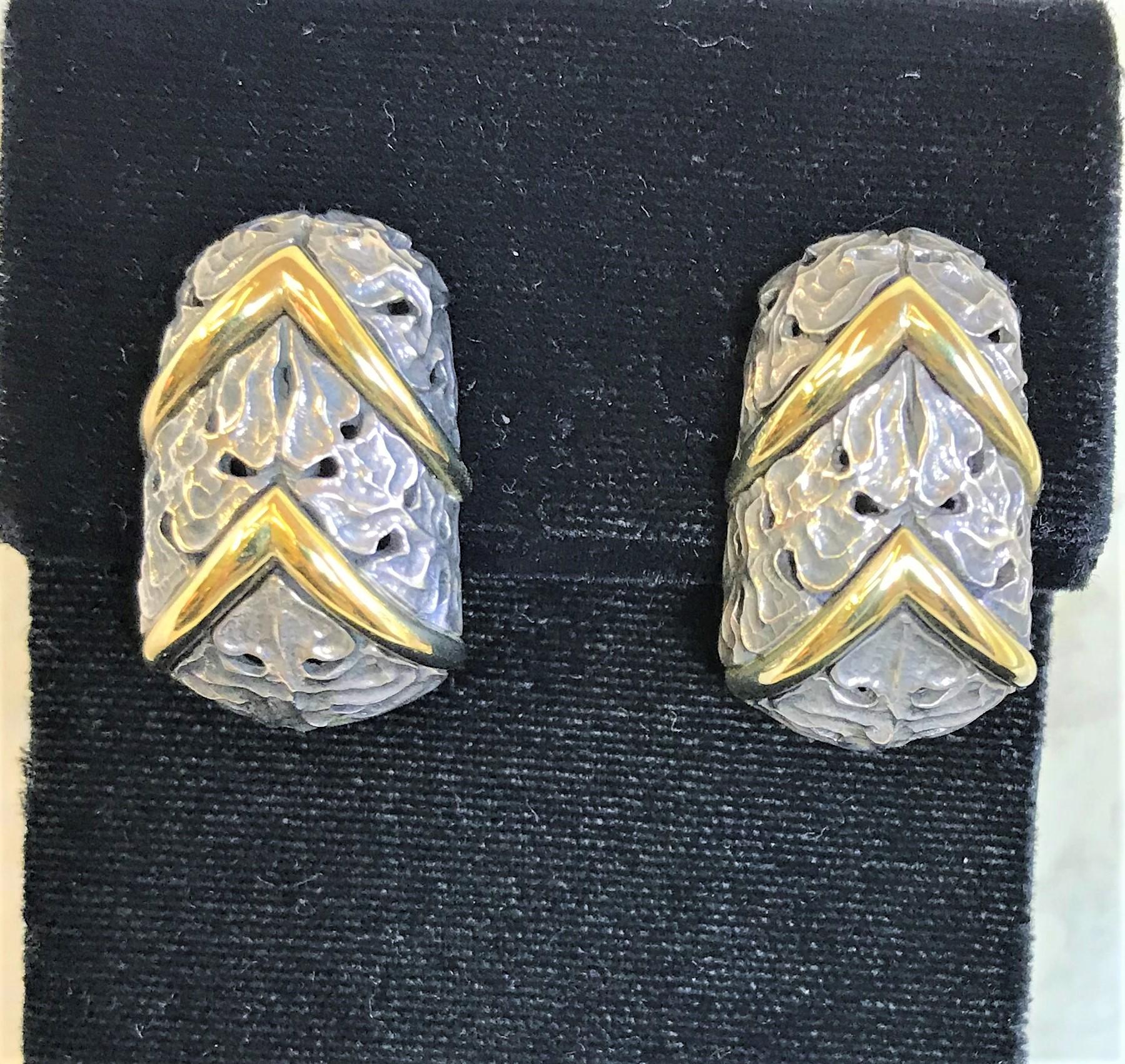 Mitchell Peck
Sterling silver floral design earrings with 18 karat yellow gold chevron pattern
Approximately 1 inch long and .5 inches at the widest 
Stamped 