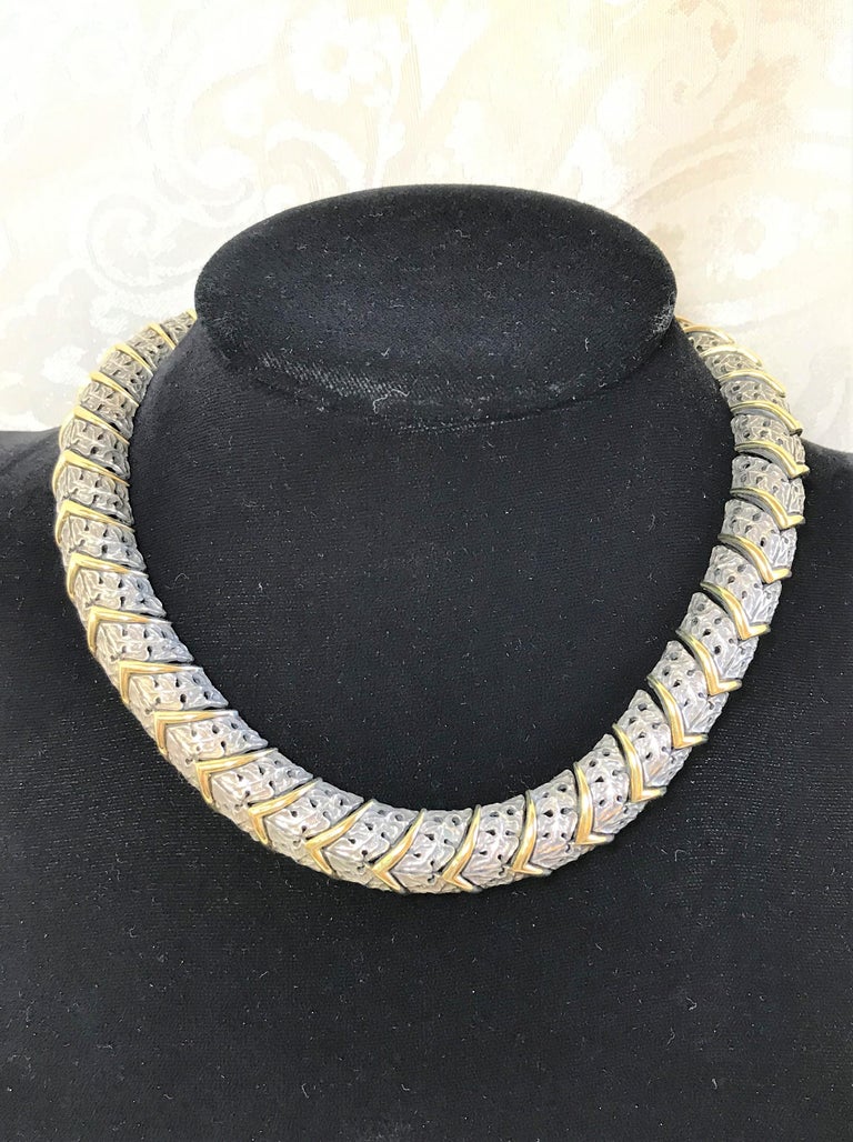 This beautiful hard to find piece is sure to be noticed! 
Mitchell Peck
Sterling Silver floral design necklace with 18 karat yellow chevron pattern
Stamped 