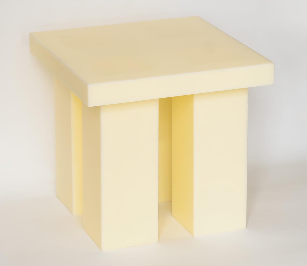 The Miter is an elemental side table that evokes mass and stability. It's available in yellow resin, raw aluminum, or burl wood, with all three versions constructed by connecting sheet materials using a miter joint.

