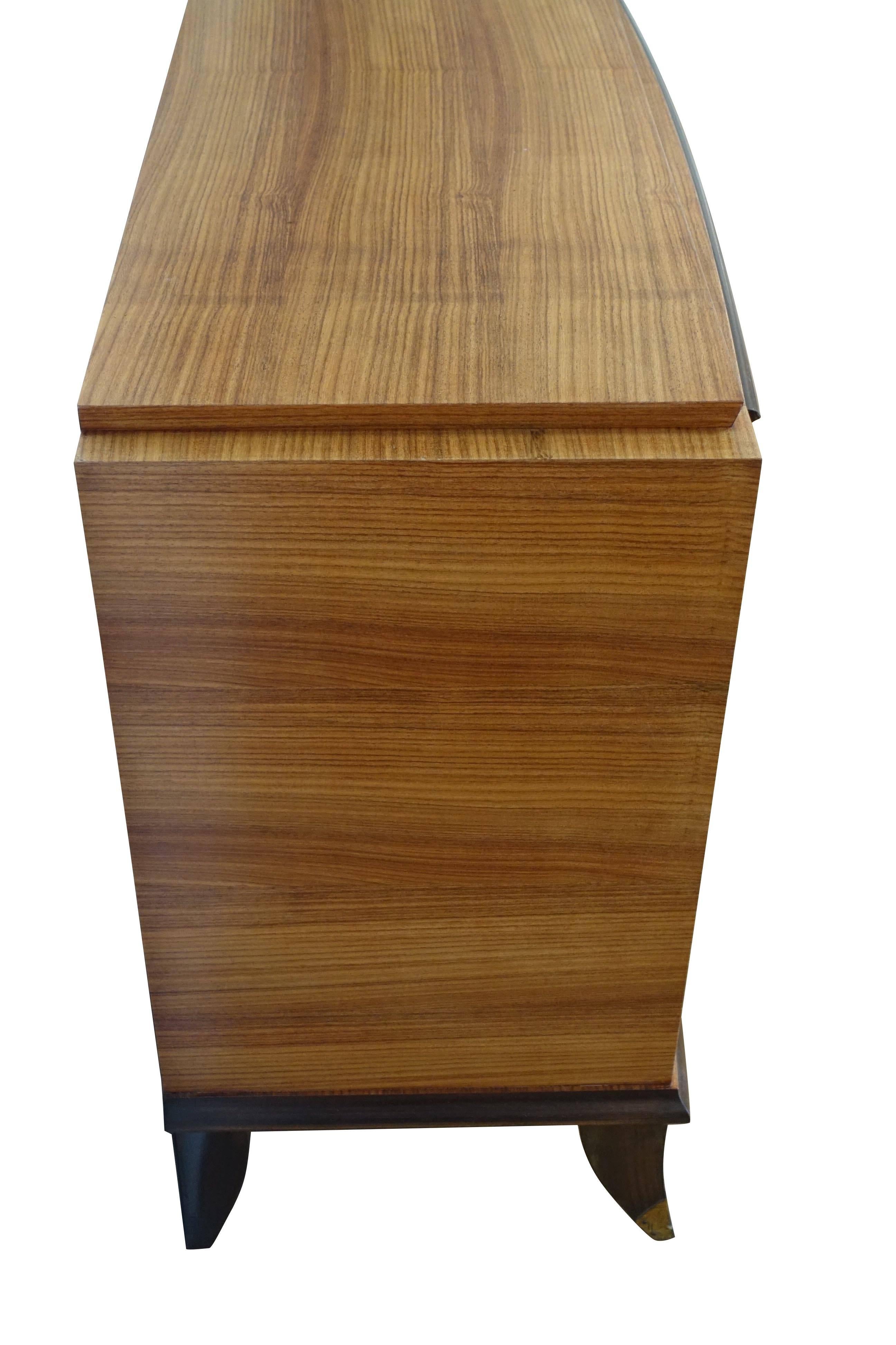 1940s French walnut mitered pattern three-drawer commode.
 Unusual step up top.
Wedge shape.
Front brass sabot legs.
Brass handles.
 