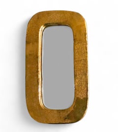 Espejo oblongo Mithé Espelt de loza repujada y oro craquelado, Francia
