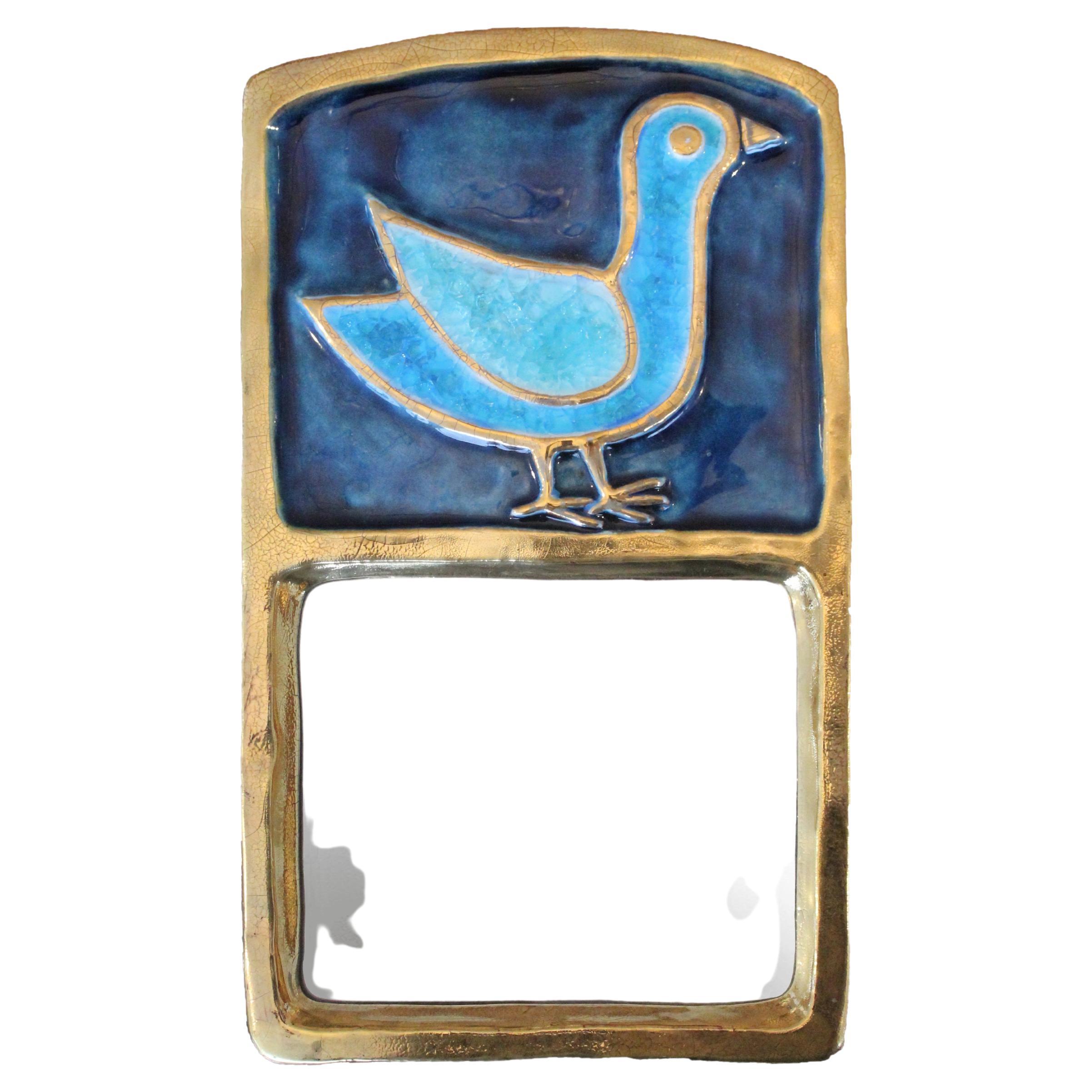 Mithé Espelt ceramic mirror, circa 1960, France.
Glazed embossed earthenware.
Crackled gold and crystallized blue glass.
Iconic mirror decorated with a bird
Original felt backing.
Circa 1960, France.
Very good condition.
The life of Mithé