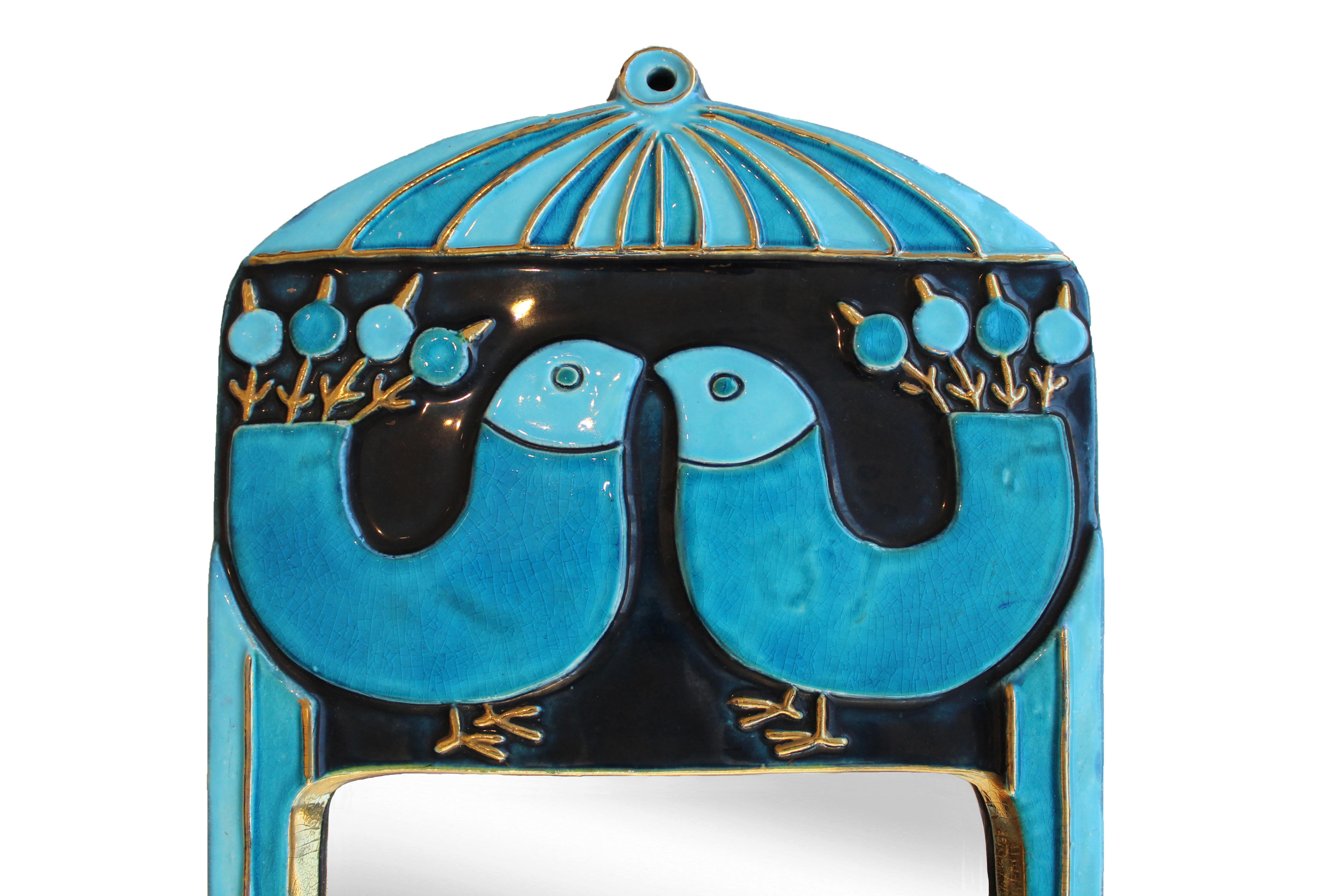 Mithé Espelt ceramic mirror, circa 1960, France.
Glazed embossed earthenware.
Crackled gold and crystallized blue glass.
Iconic mirror decorated with birds.
Original felt backing.
Circa 1960, France.
Very good condition.
The life of Mithé