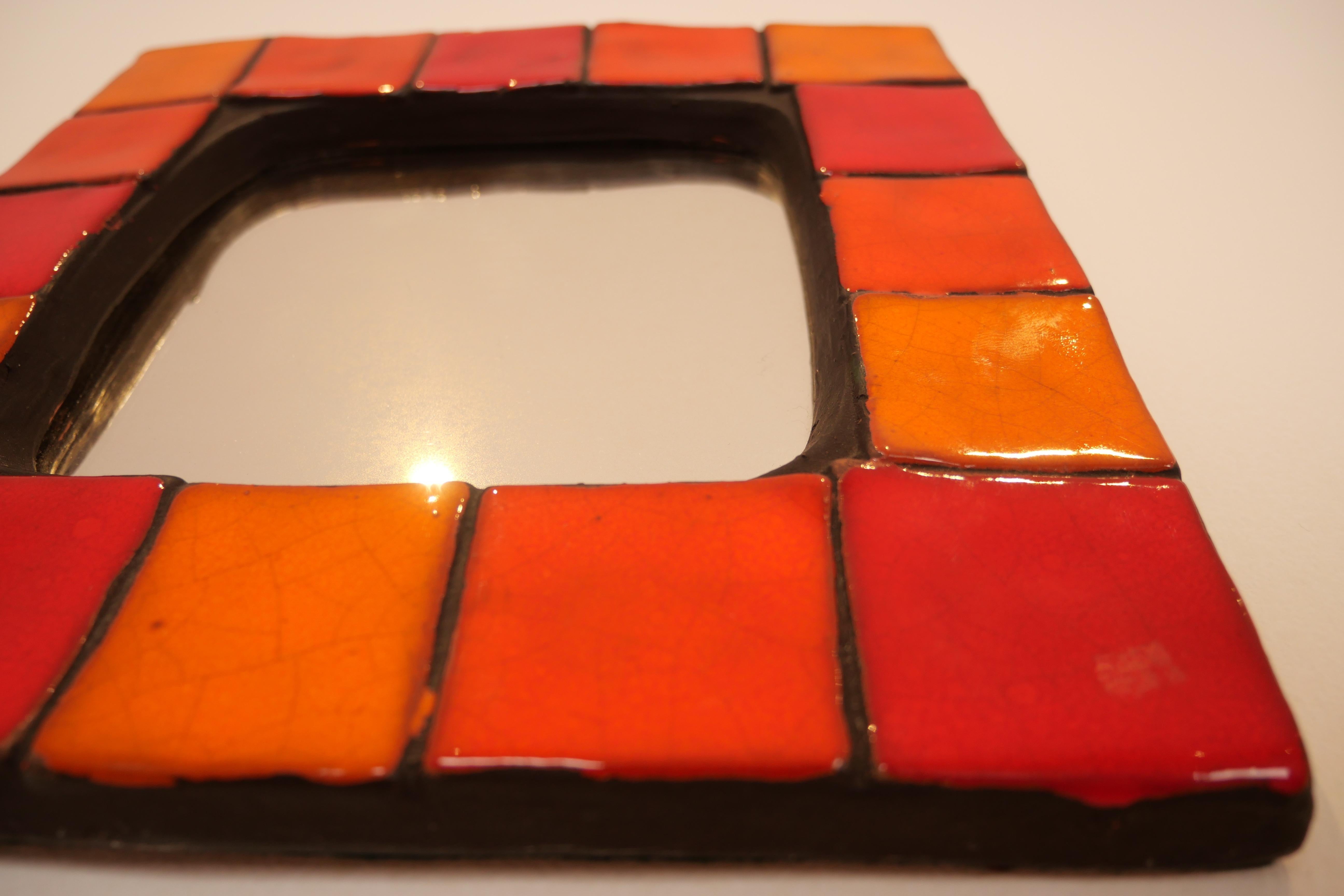 Mid-20th Century Mithe Espelt Ceramic Mirror in Various Shades of Red and Orange 60's For Sale
