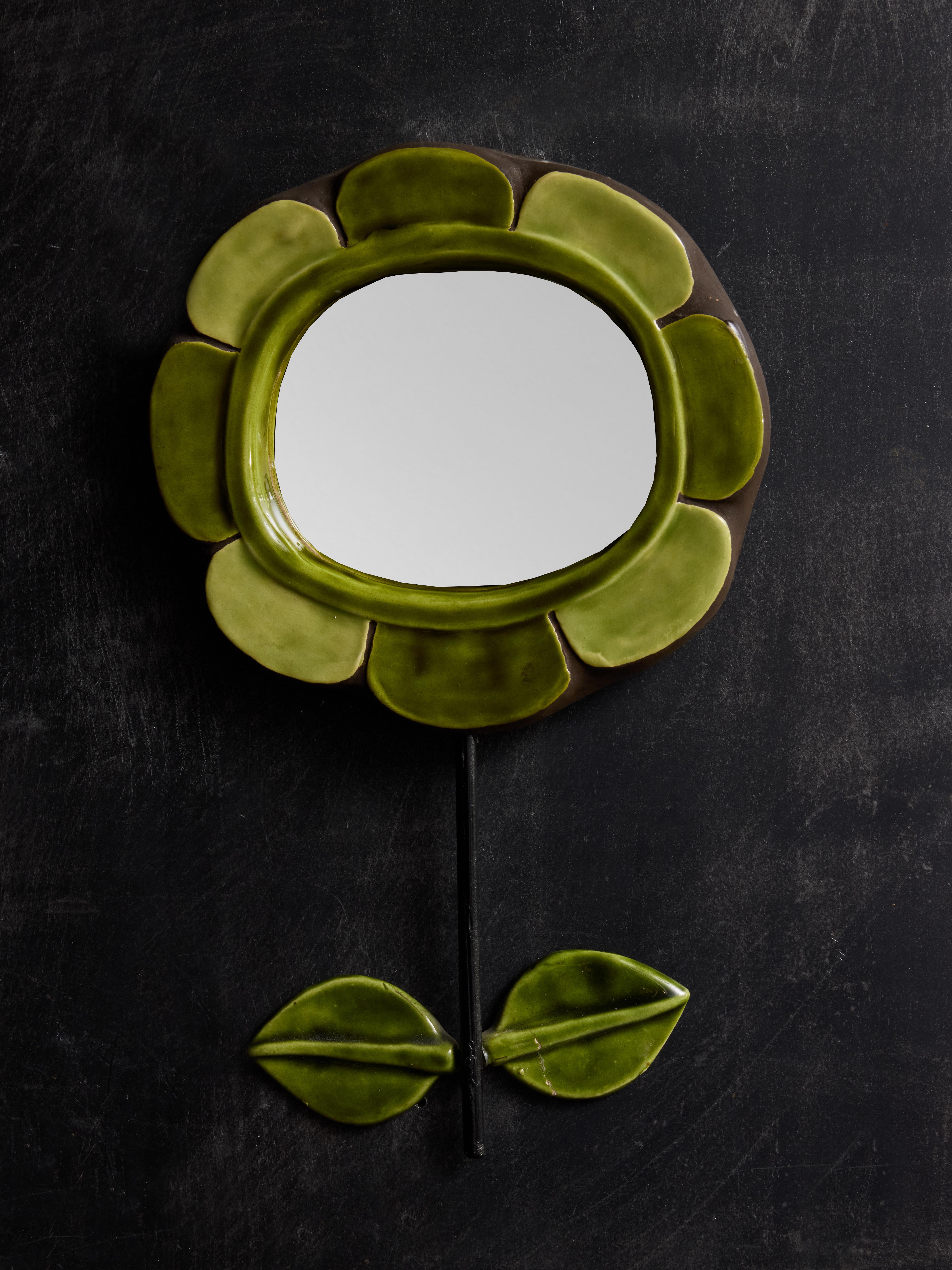 Ceramic mirror shaped like a flower with green petals. Vertical metal stem on which is attached two green coloured ceramic leaves. Made by Mithé Espelt.



Marie Thérèse Espelt, aka. Mithé Espelt (1923-2020)



Born in the town of Lunel, near