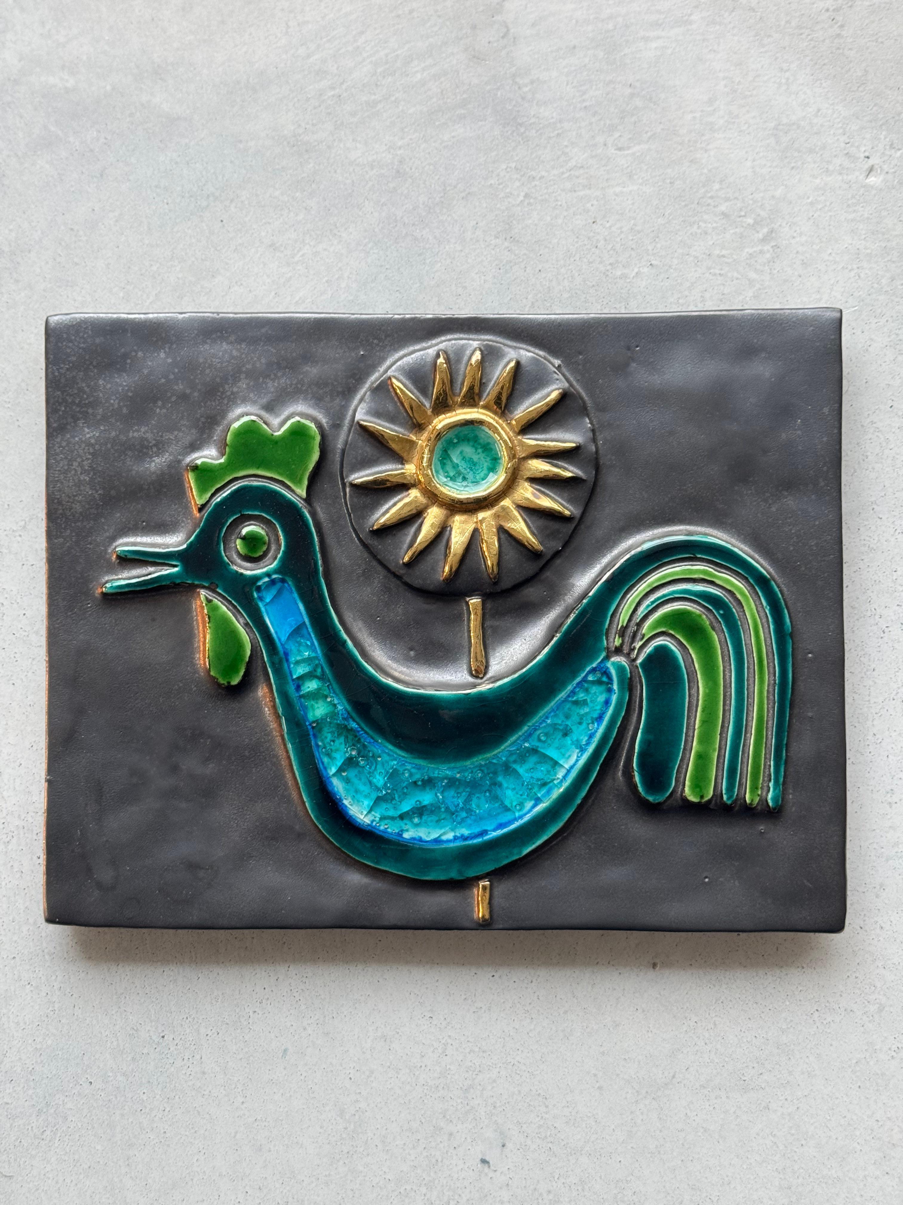 Unique and large sculpted ceramic wall plaque made by the French ceramic artist Mithé Espelt (1923 - 2000).

Matte black background, enameled decor with rooster and sun in turquoise, green and gold shades.

Exceptional quality work.

Very good