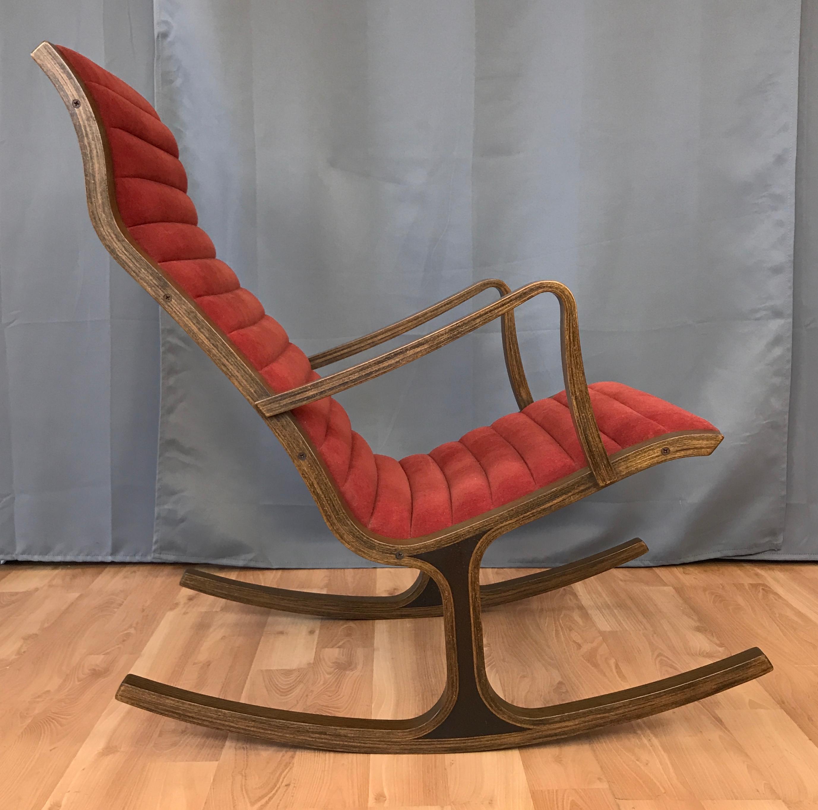A vintage “Heron” high back oak rocking chair designed in 1966 by Mitsumasa Sugasawa for Tendo Mokko. 

Rocker's thin bentwood frame references the lithe lines of its namesake. Ergonomic form and low profile padding create a sinuous silhouette