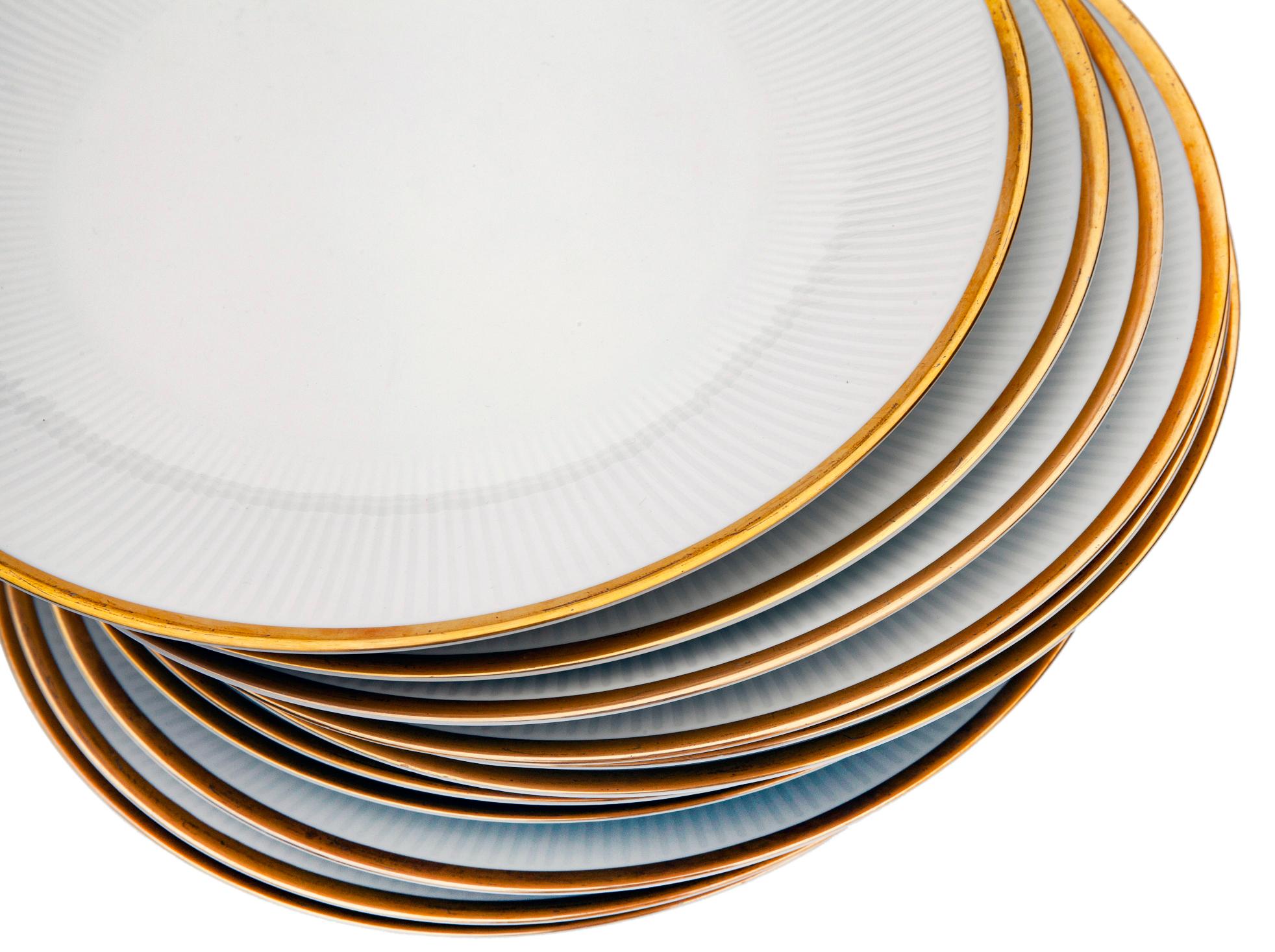Mid-century Bavarian dinner plates by Mitterteich  in bright white with gold rim. 