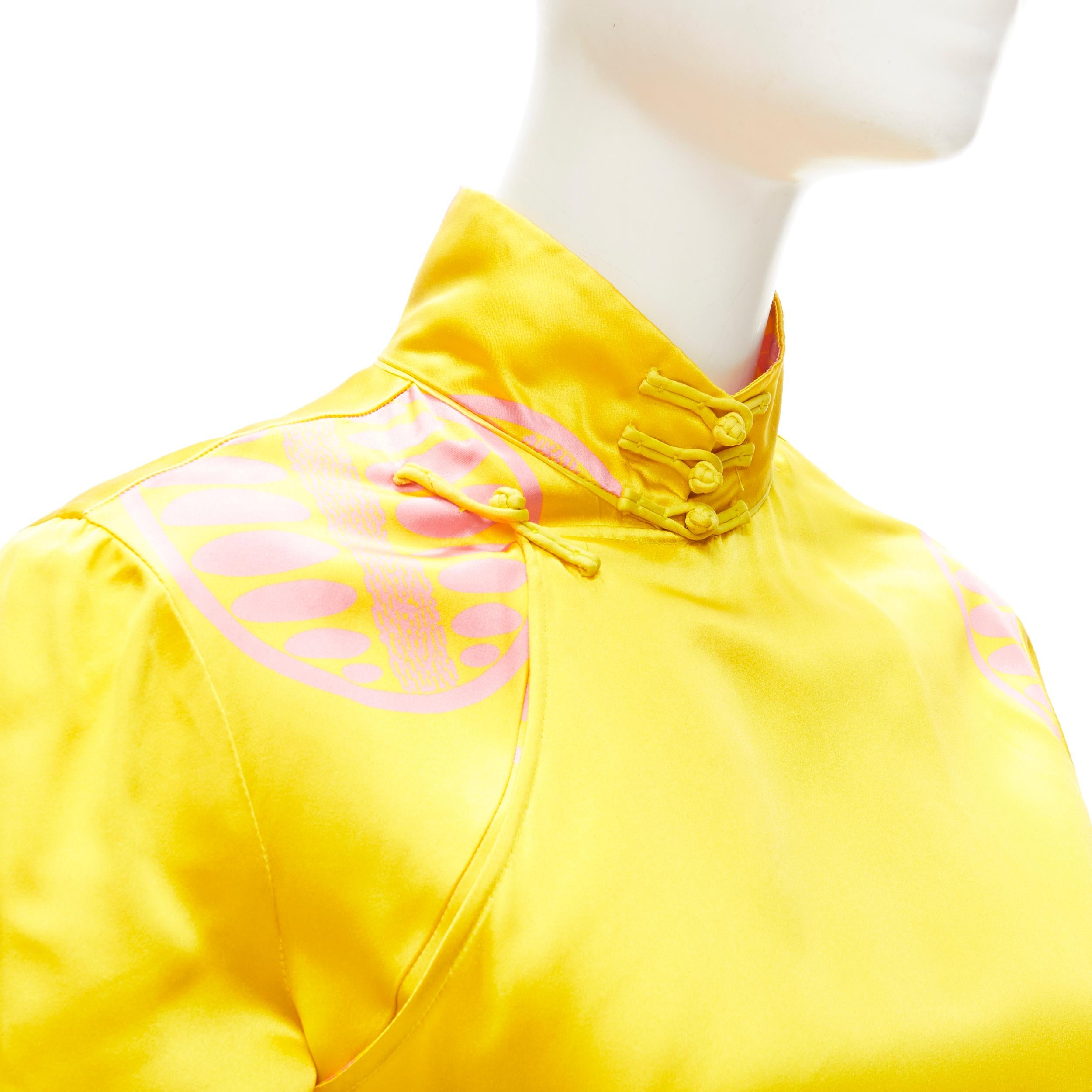 MIU MIU 100% silk yellow pink print Chinoiserie button cheongsam shirt IT38 XS 
Reference: ANWU/A00475 
Brand: Miu Miu 
Designer: Miuccia Prada 
Material: Silk 
Color: Yellow 
Pattern: Solid 
Closure: Button 
Extra Detail: Cheongsam inspired design.